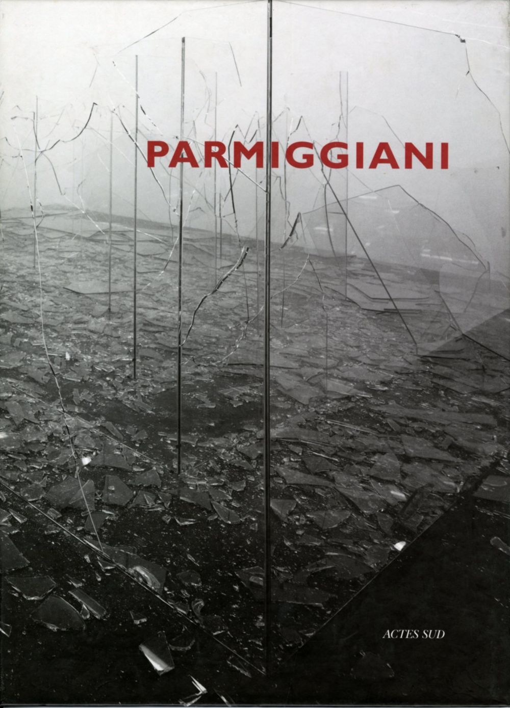 Book cover on plain gray background with title of Claudio Parmiggiani