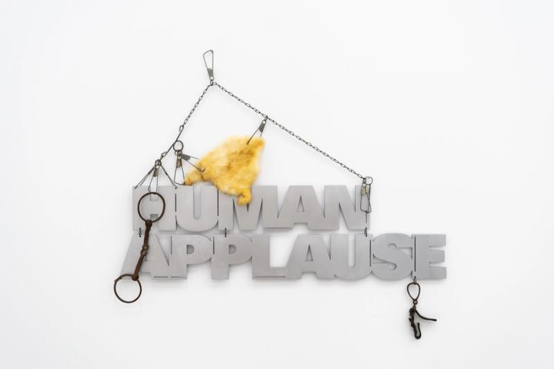 Installation view of displayed artwork titled Human Applause