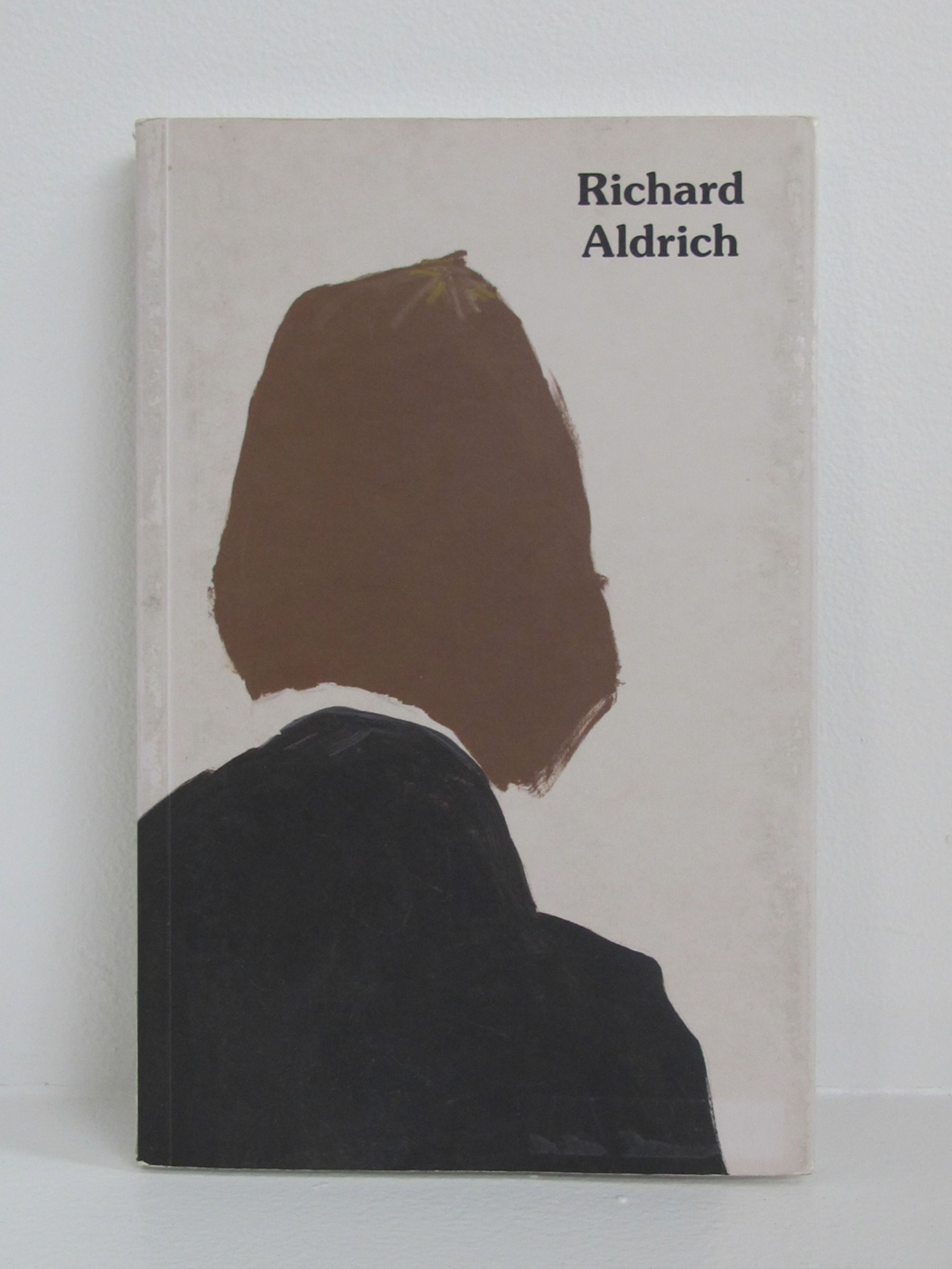 Detail view of Richard Aldrich against a plain gray background