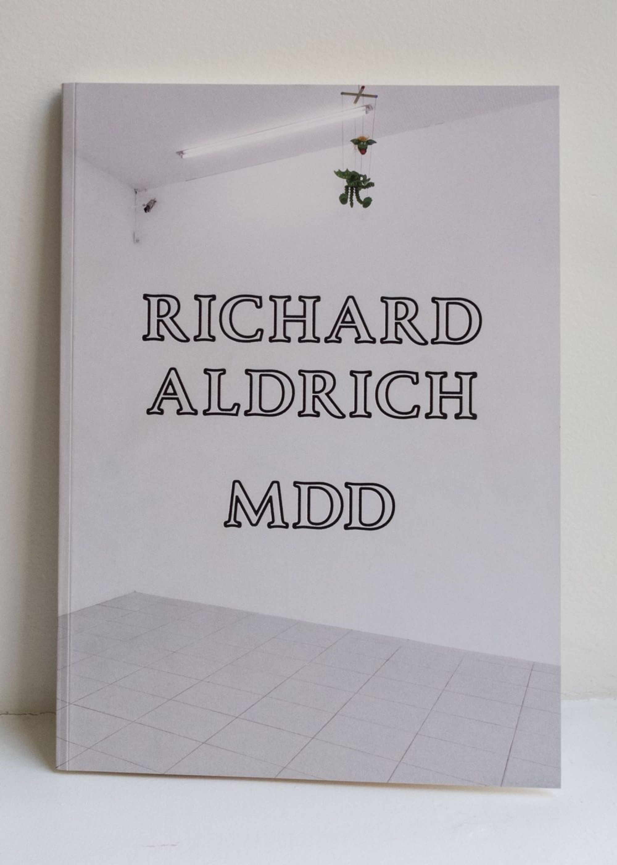 Book cover on plain background with title of Richard Aldrich: MDD