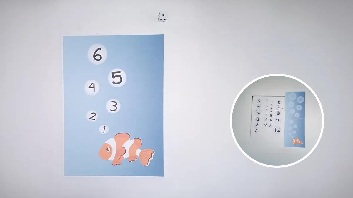 Плакат с оранжева рибка и балончета с числа от 1 до 6.