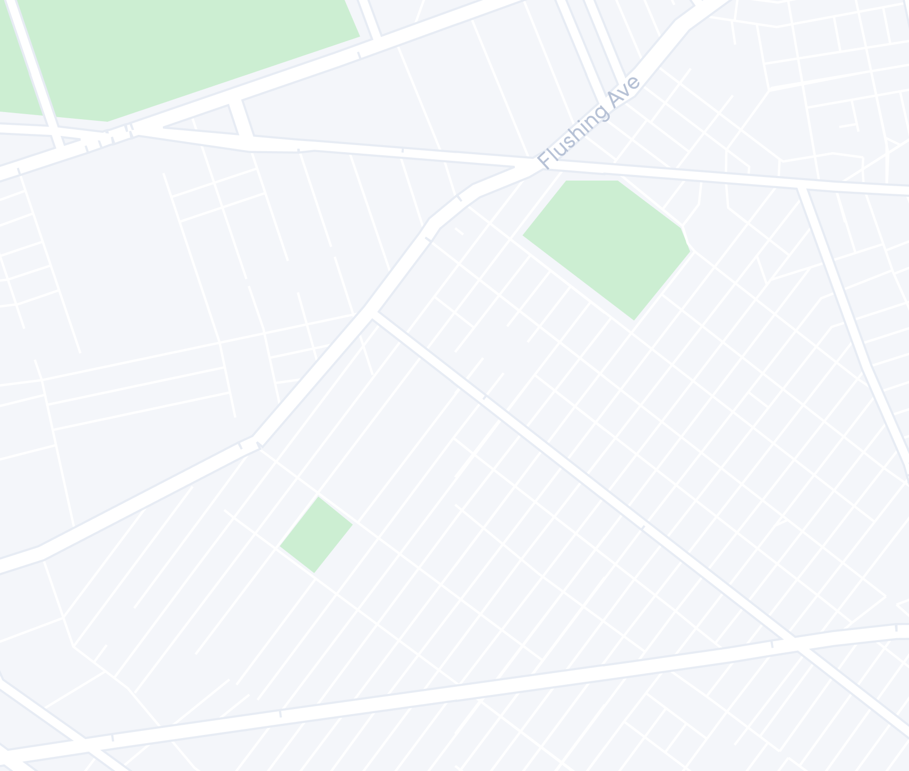 A minimalist map showing a street grid and green spaces