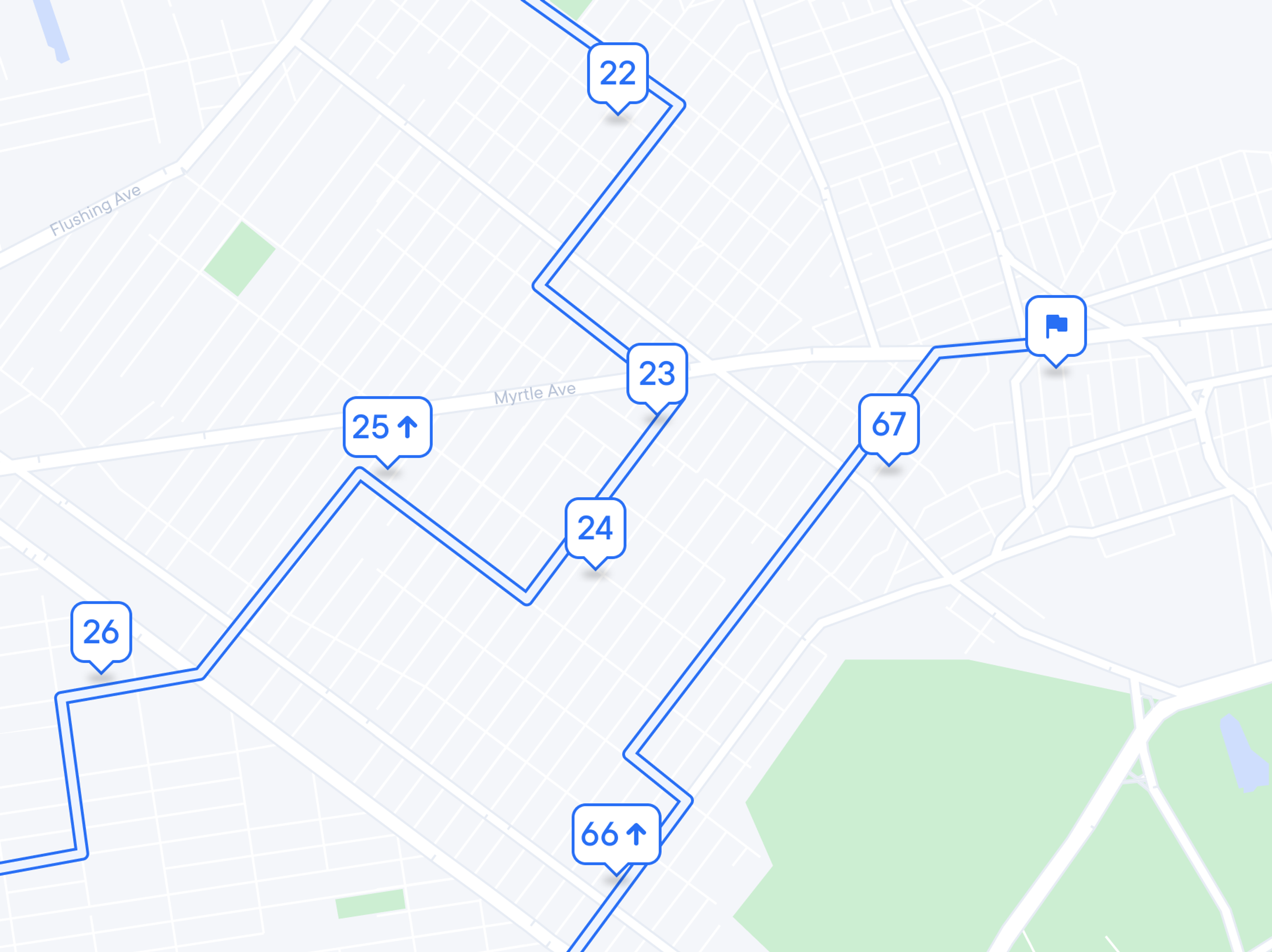 Map displaying a blue route with numbered markers and a flag icon for the destination.