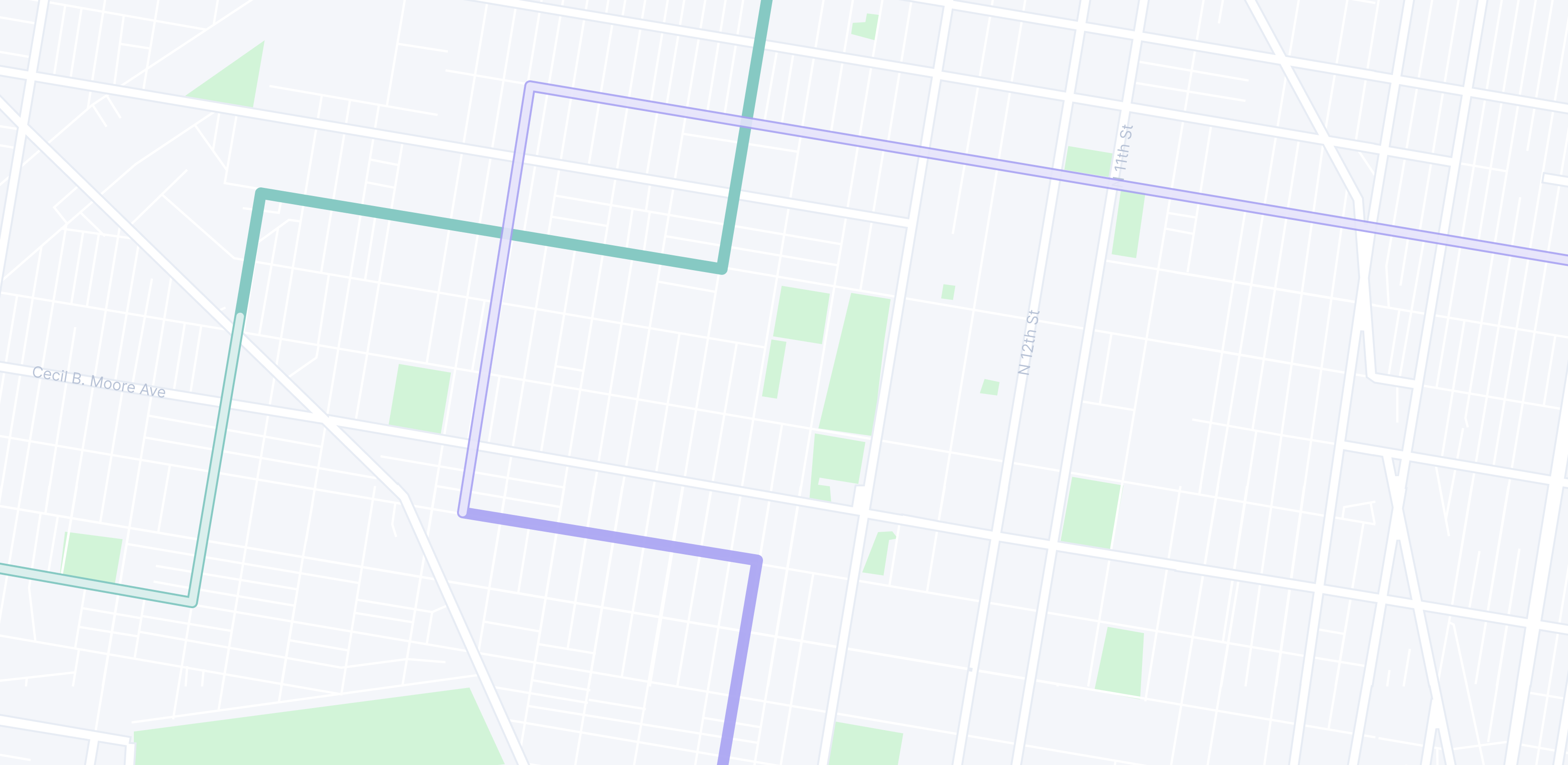 A map showing city streets with green and purple routes highlighted.