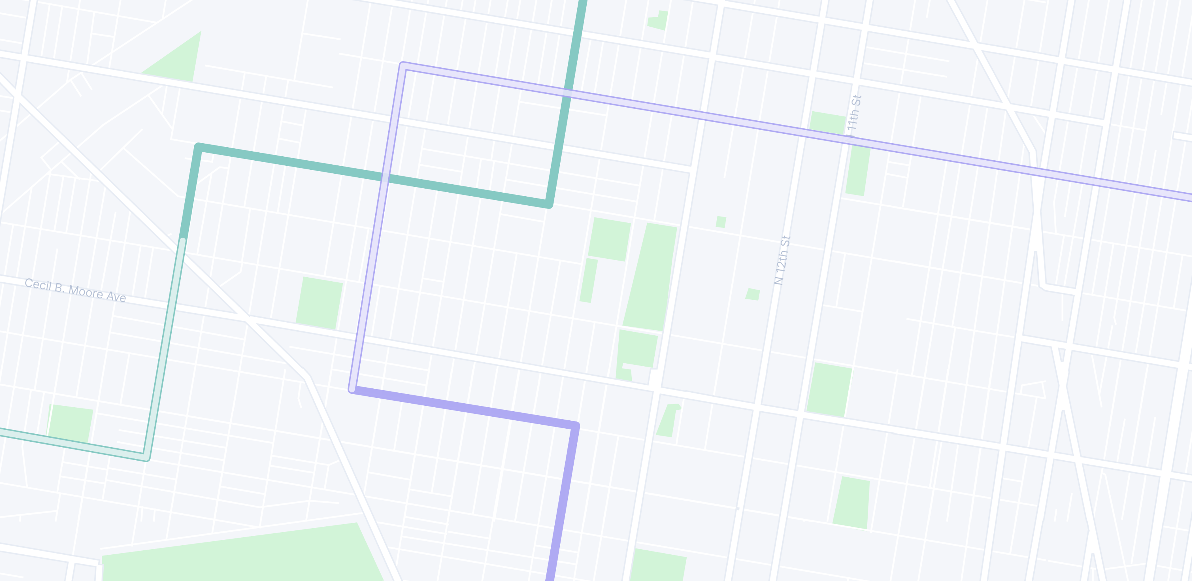 A map showing city streets with green and purple routes highlighted.