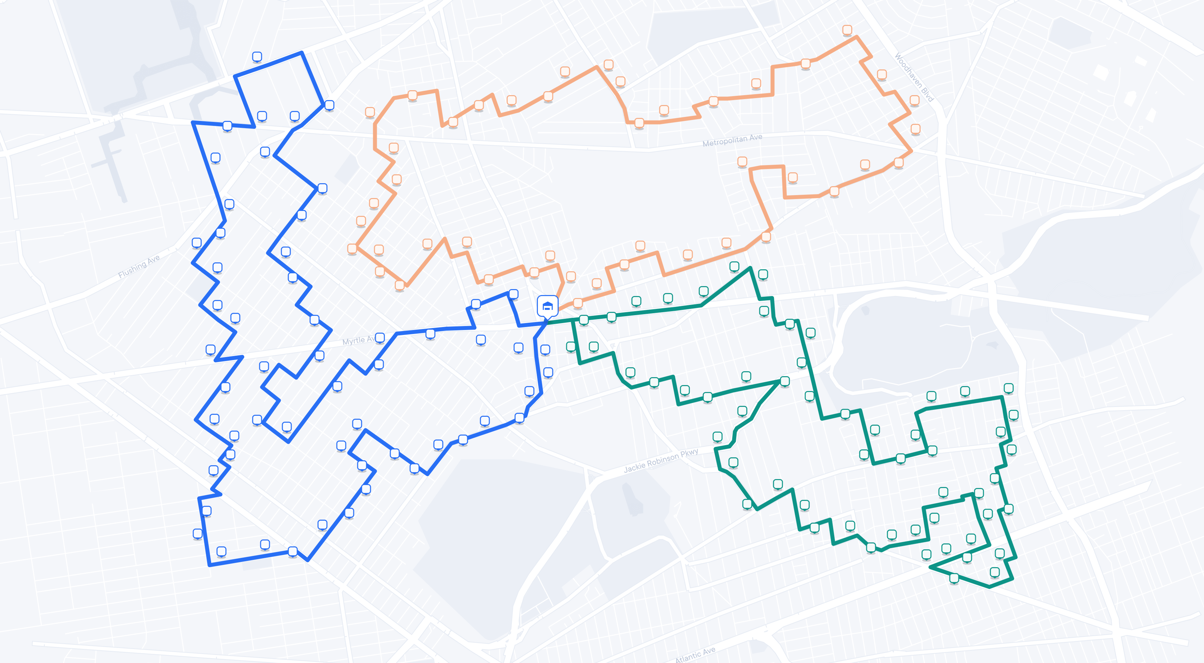 A city map similar to the first image, now displaying three distinct delivery routes in different colors: blue, orange, and green. Each colored line connects a series of square icons representing stops along the route, all originating from the central depot icon. The map visualizes optimized routing paths for deliveries.