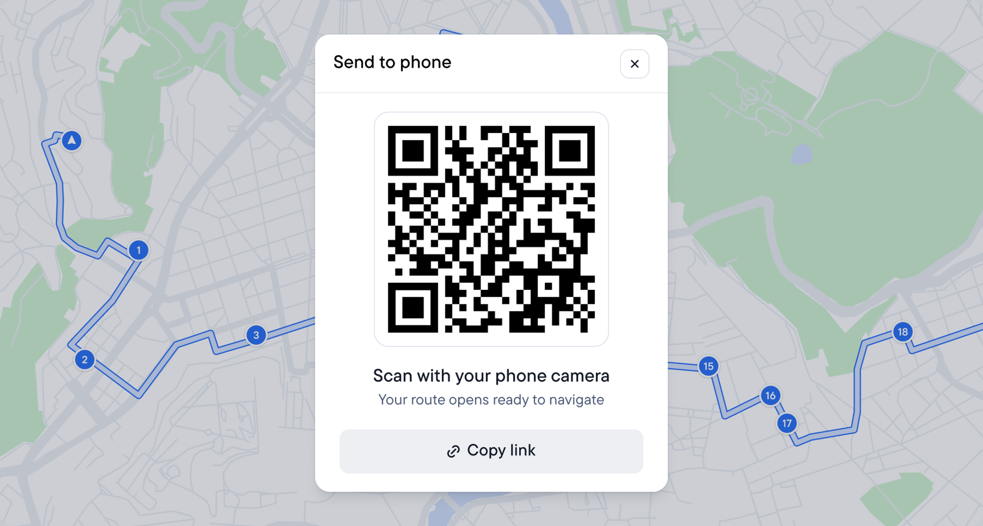 A map displaying a route with a "Send to phone" pop-up showing a QR code.