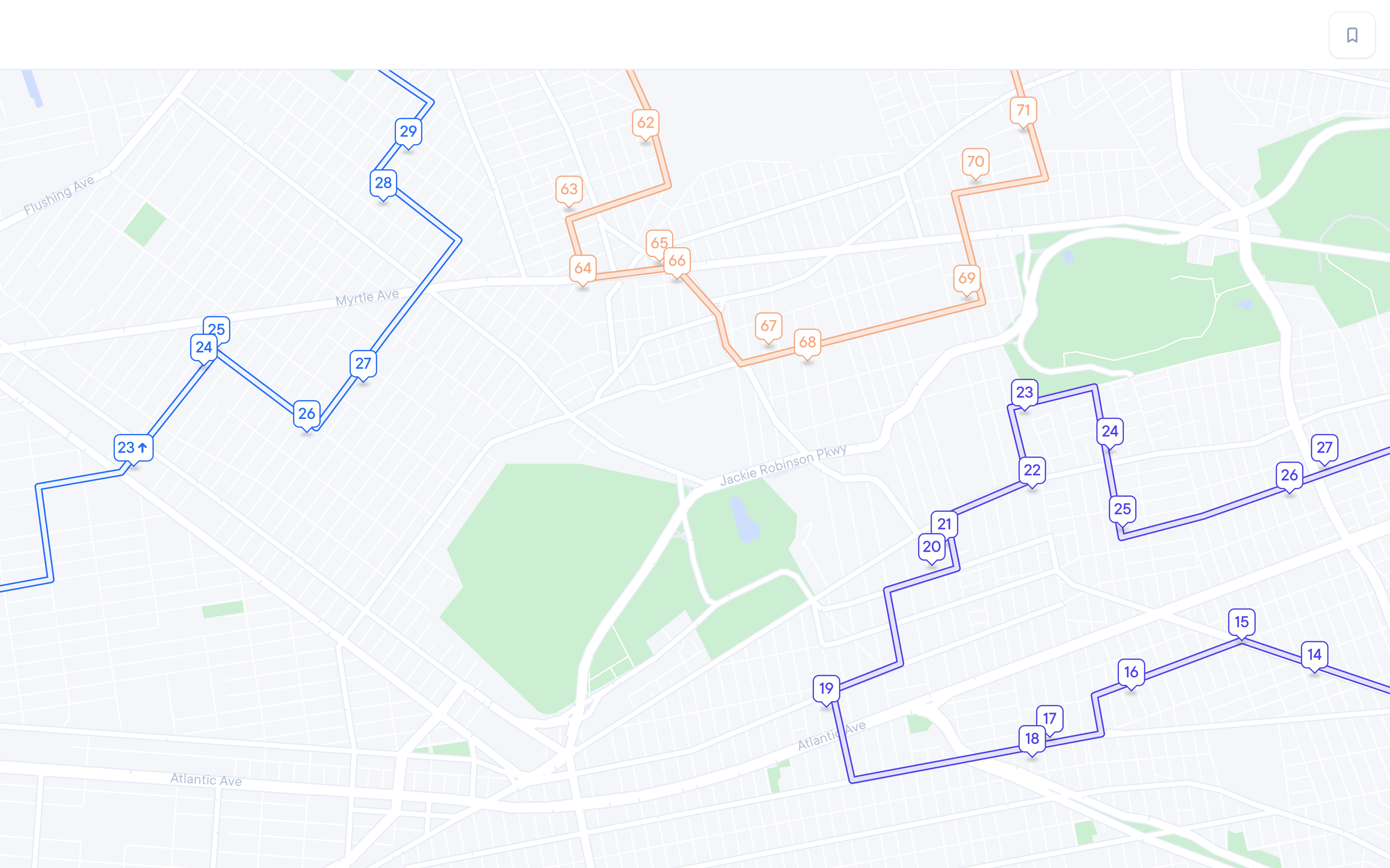 City map showing three distinct delivery routes, each marked by a colored line and numbered stop bubbles. On the left, a blue route weaves through streets with stops labeled 23→24→25→26→27→28→29. In the center top, an orange route runs with stops 62→63→64→65→66→67→68→69→70→71. On the bottom right, a purple route follows Atlantic Ave and nearby roads with stops 19→20→21→22→23→24→25→26→27. A section of Jackie Robinson Pkwy is visible between the center and bottom routes.