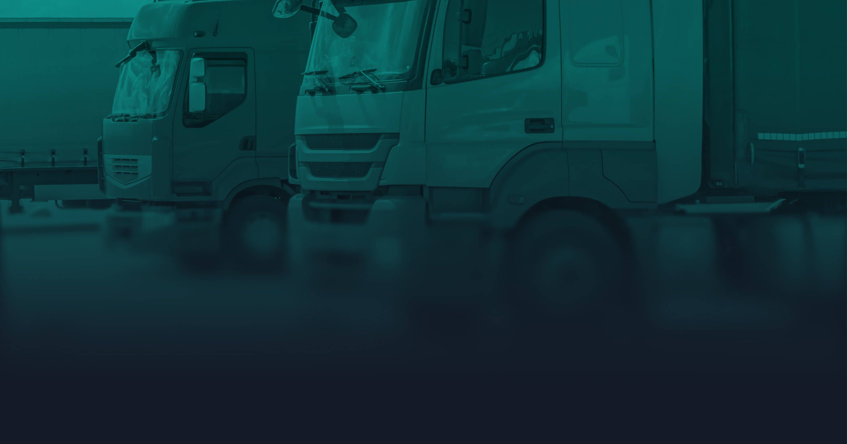 Row of large commercial trucks parked side by side in a logistics yard, overlaid with a teal color filter.