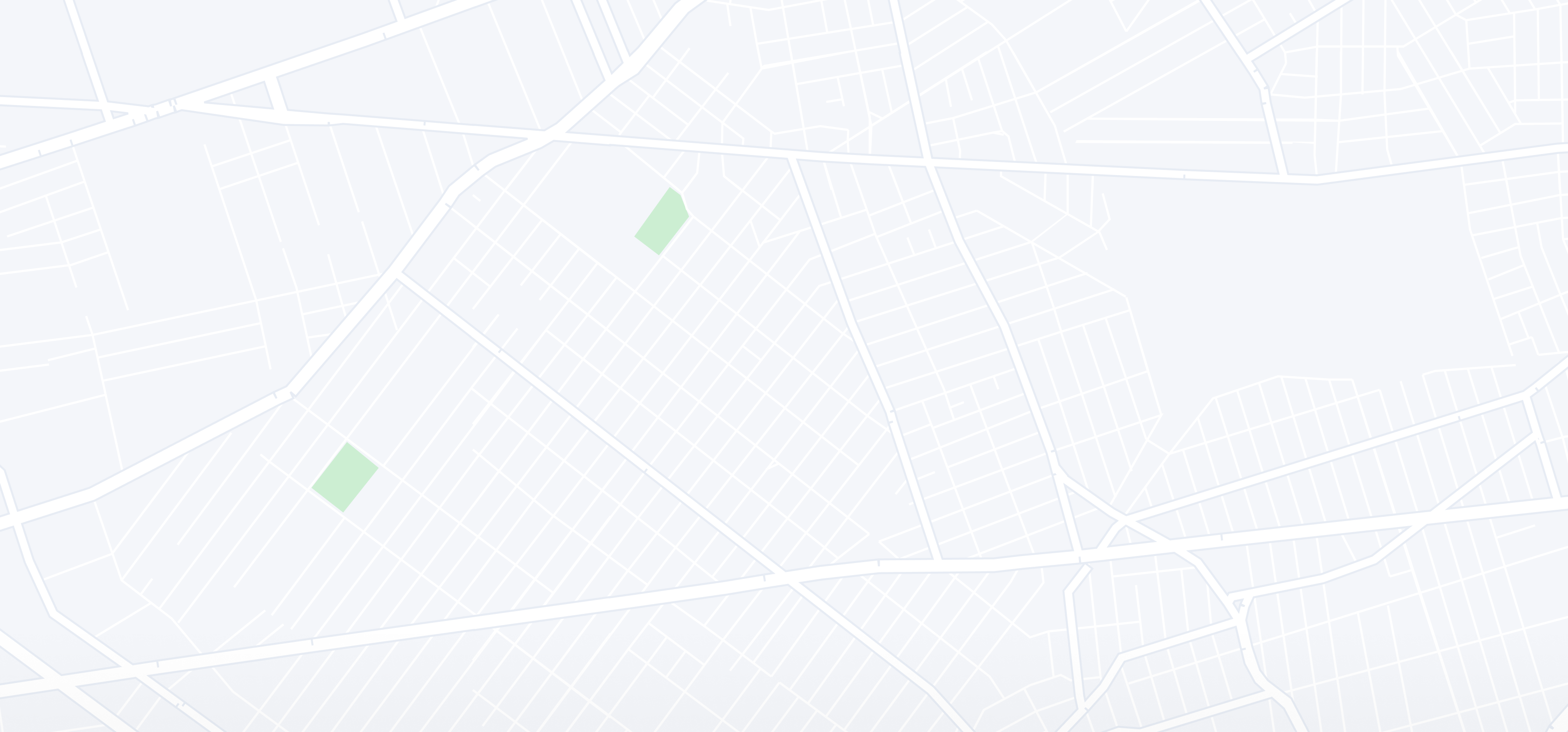 A city map with roads and green areas.