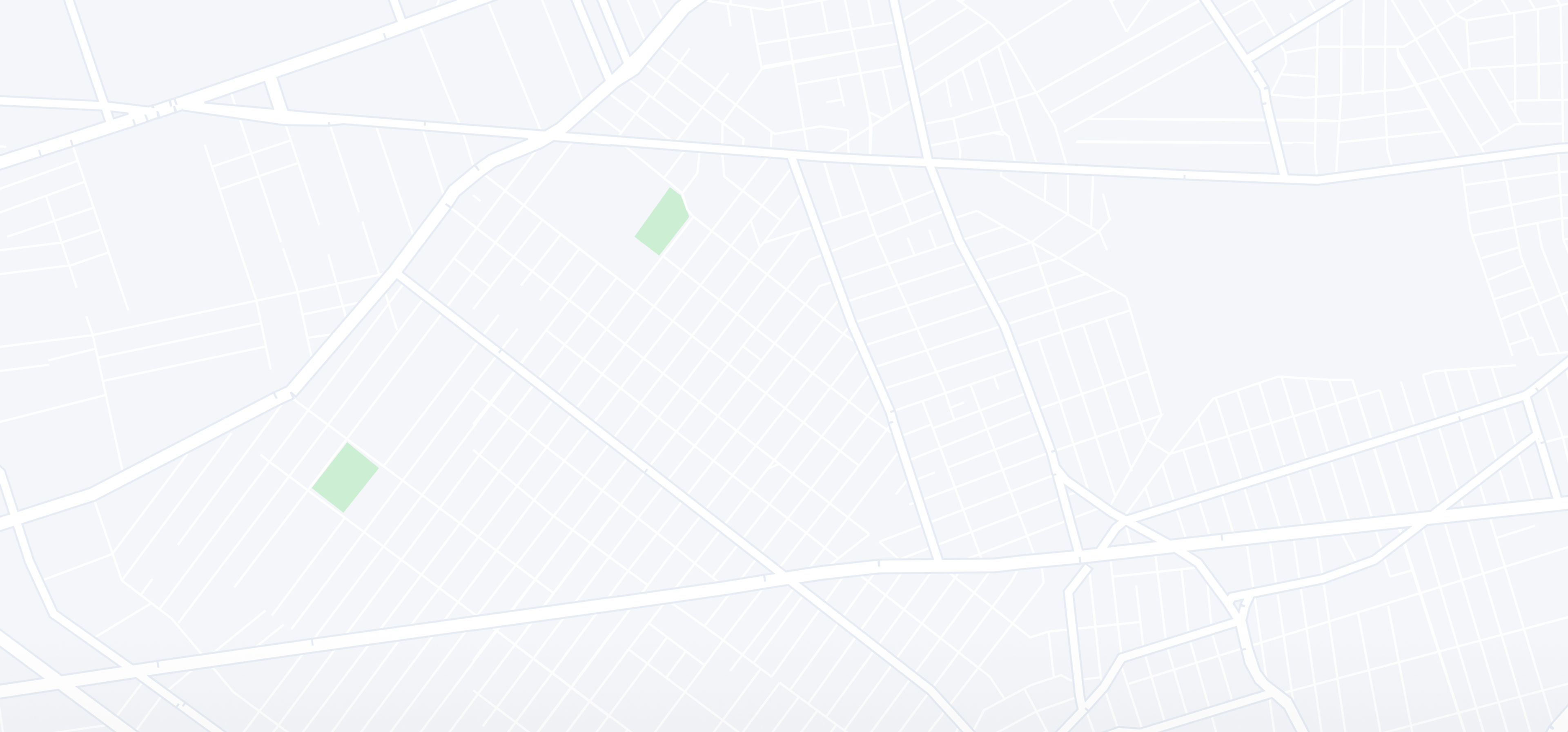 A city map with roads and green areas.