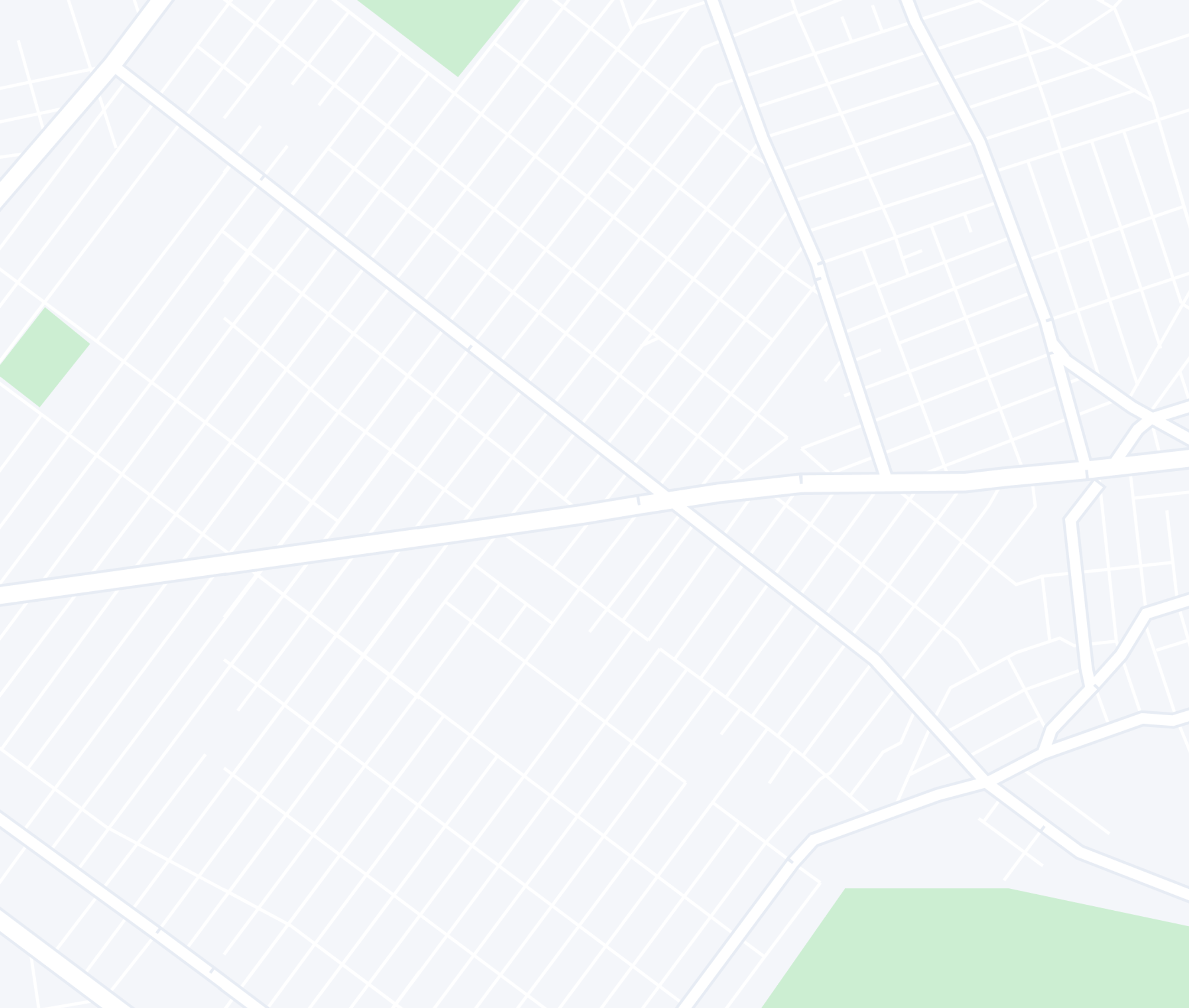 A minimalist map showing light grey streets and light green park areas.