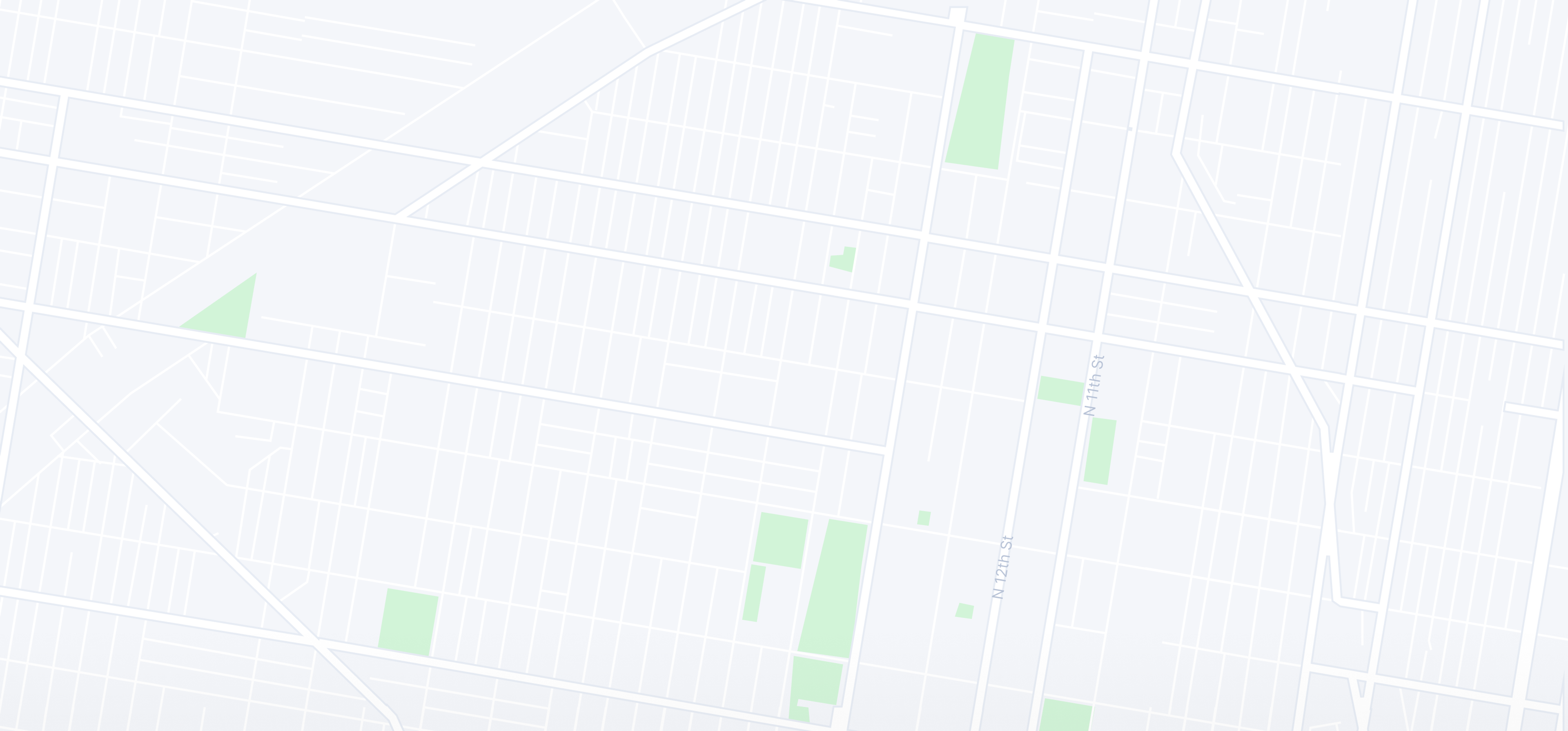 Minimalist map with light grey streets and subtle green areas.