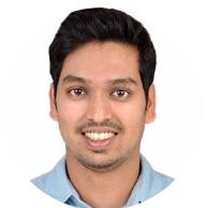 Headshot of a smiling man.