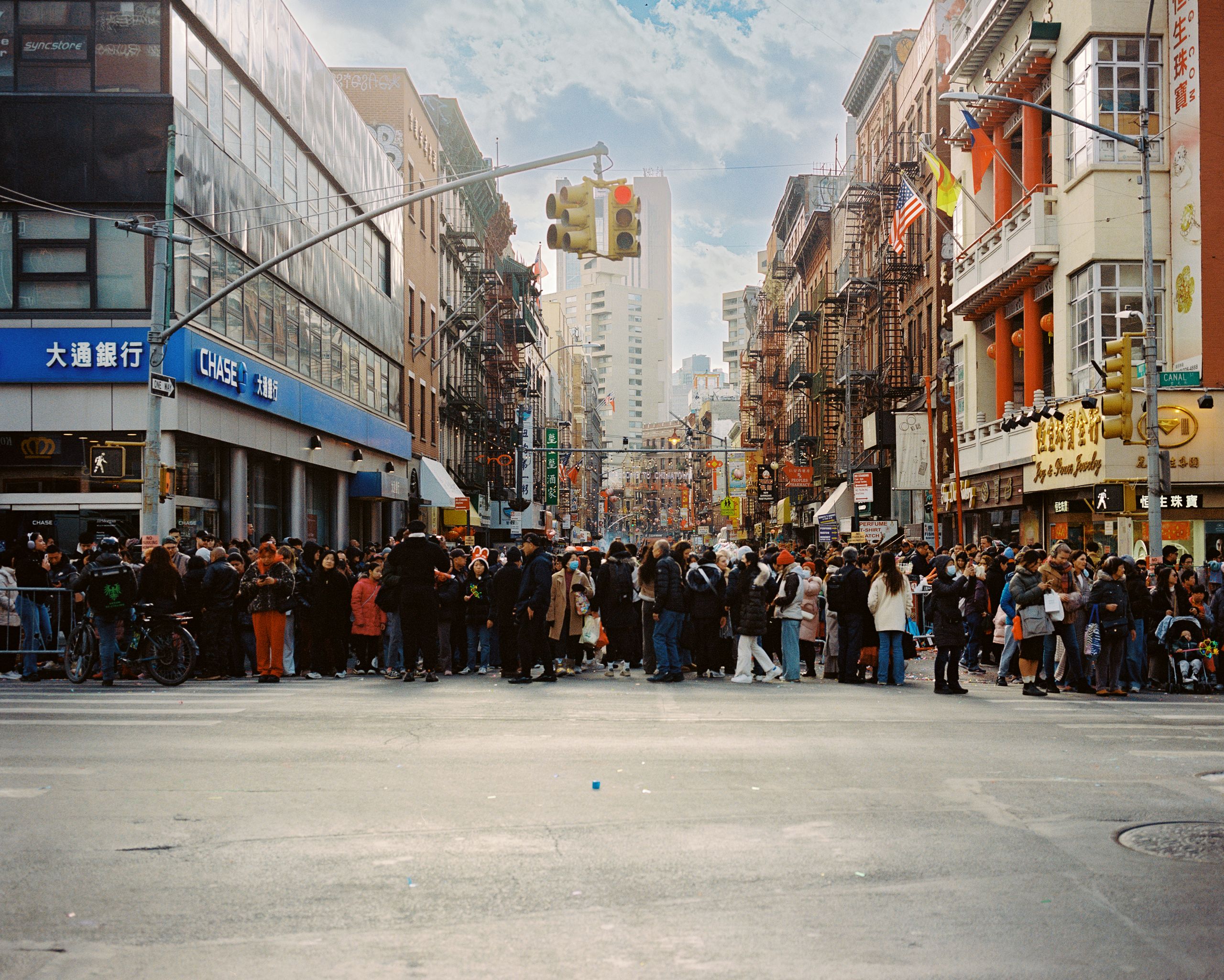 Crowds gathering at an intersection in Chinatown before the Lunar New Year festivities