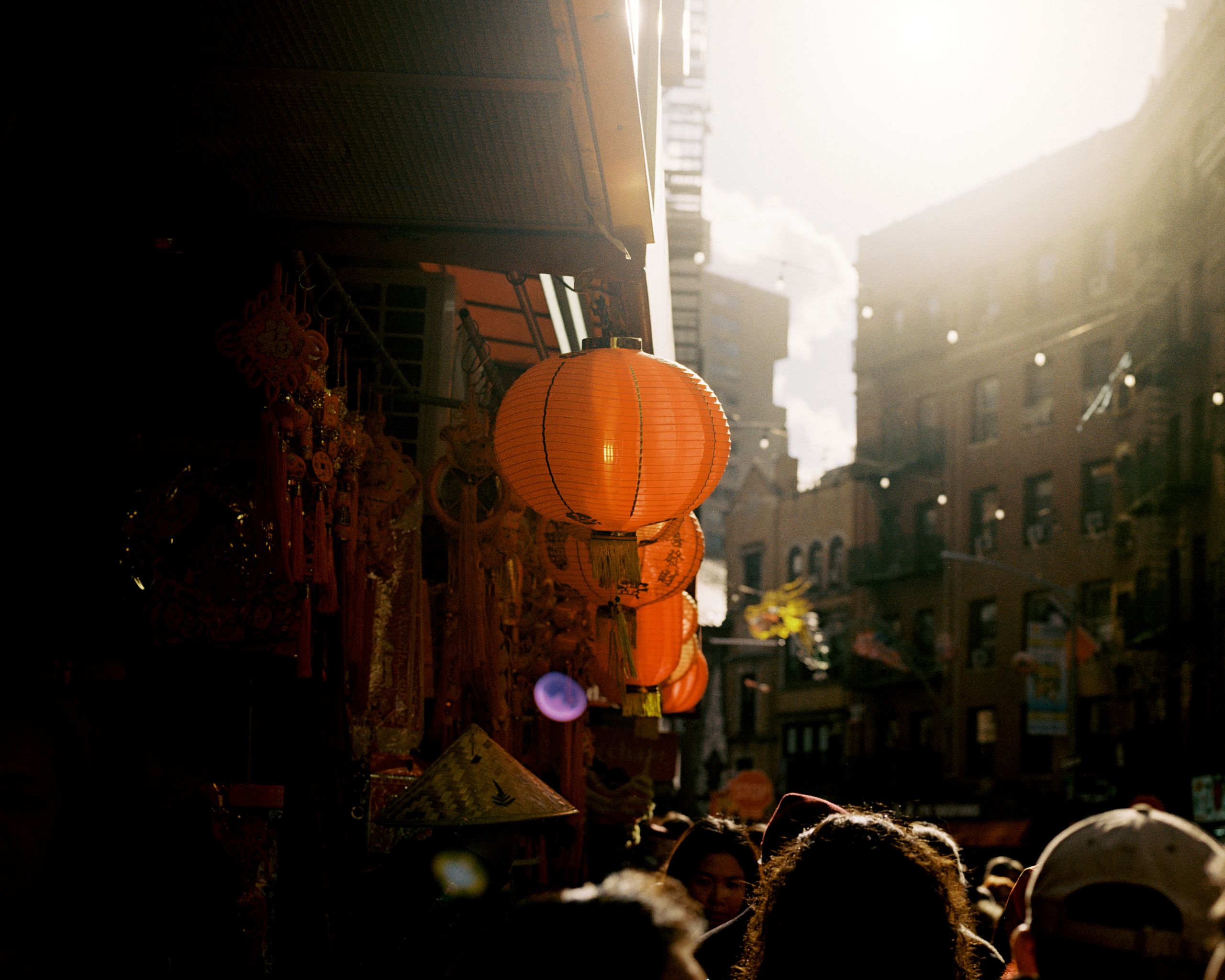 Lunar New Year celebration on a crowded Chinatown street, shot on film