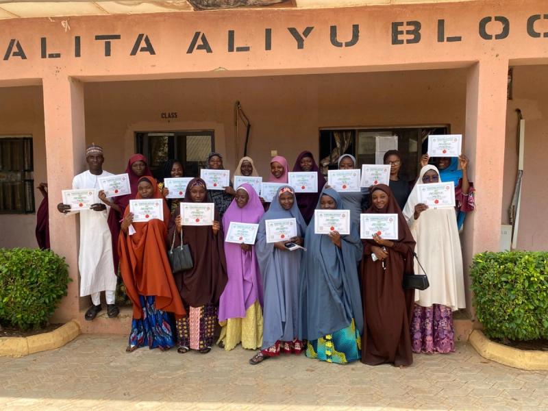 Trainees showing off their certificates after the exams
