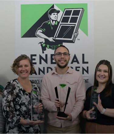 An RBA representative standing in front of a house.