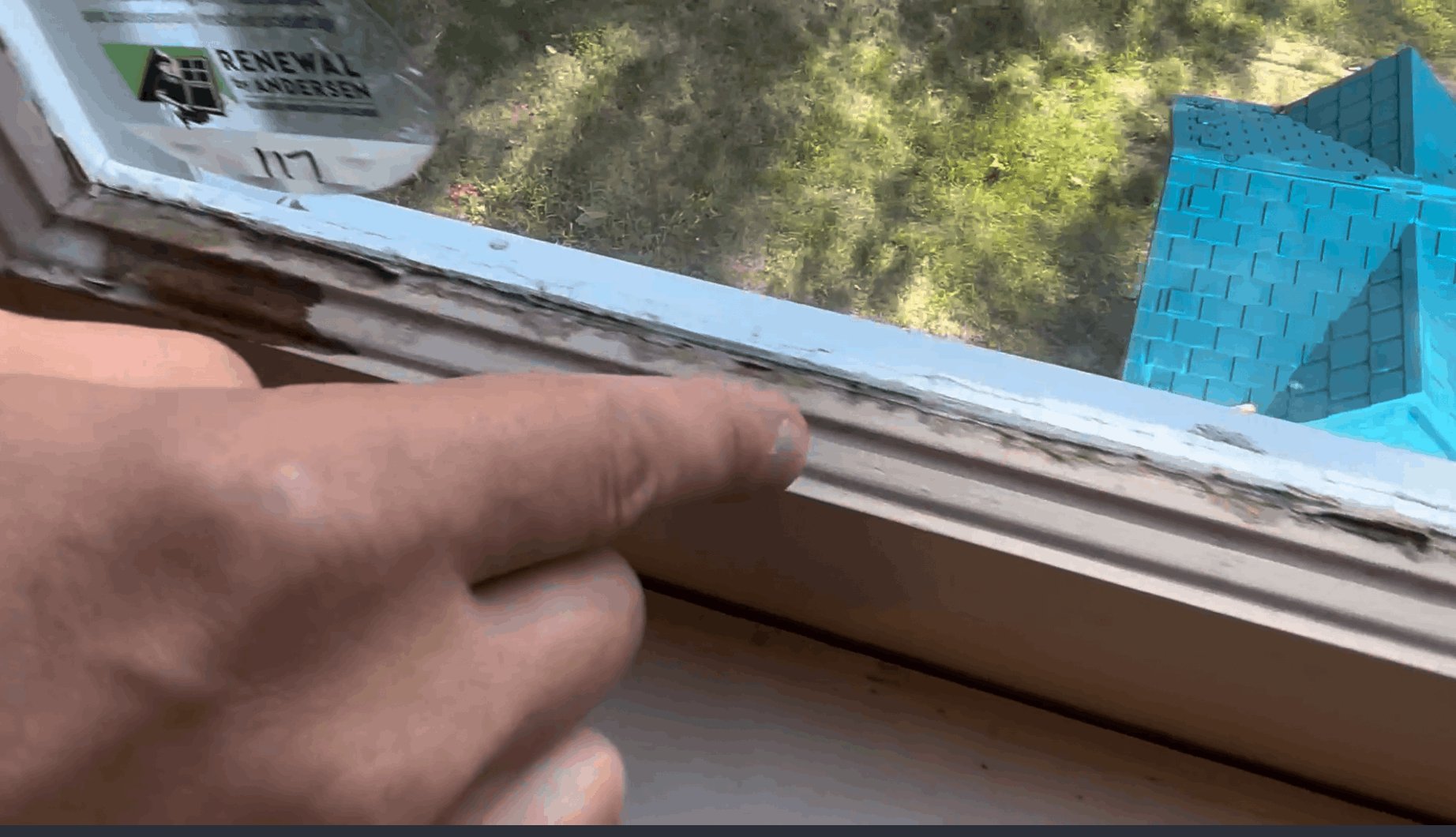 Renewal by andersen consultant points out old windows and answers questions