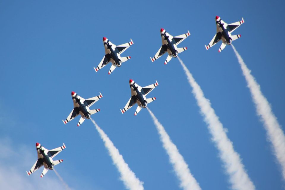 Six airplanes flying in unison for the Dayton Air Show.