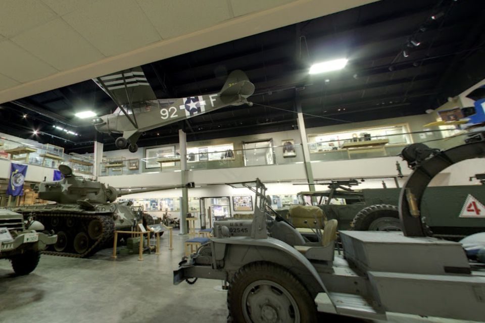 Vehicles, tanks, and airplanes inside the Wrigth World War II Museaum.