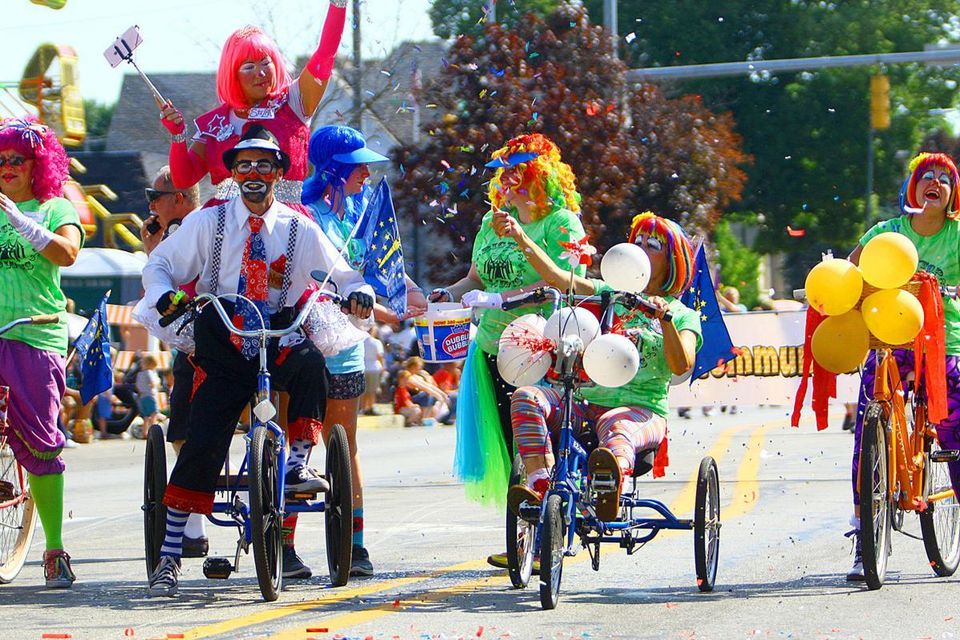 Clowns riding tricycles for the Circus City Parade.