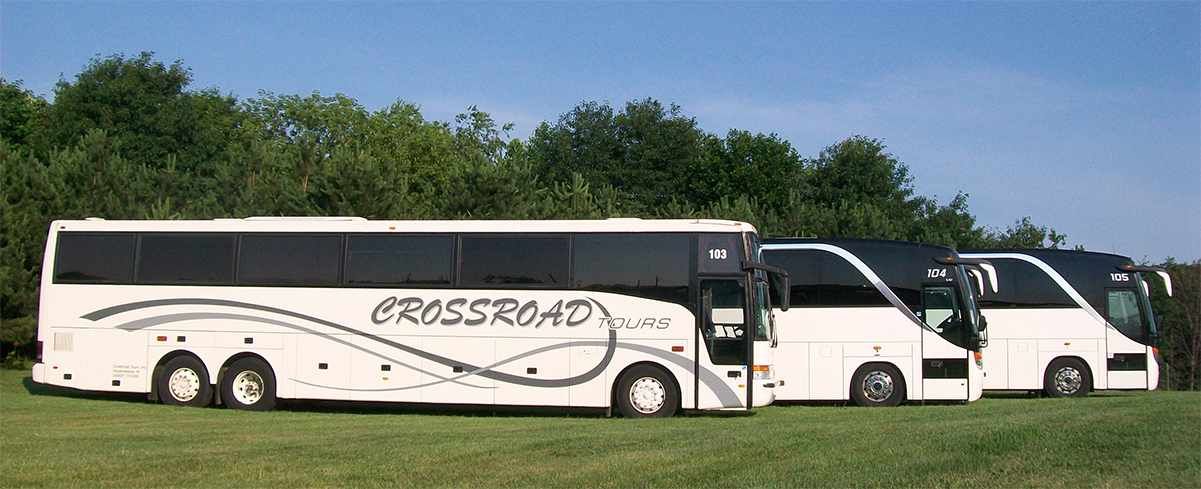 Three Crossroad Tours buses line up.