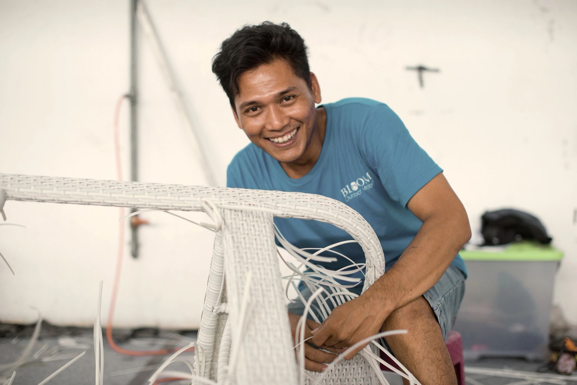 Skilled craftsman hand-weaving premium outdoor furniture