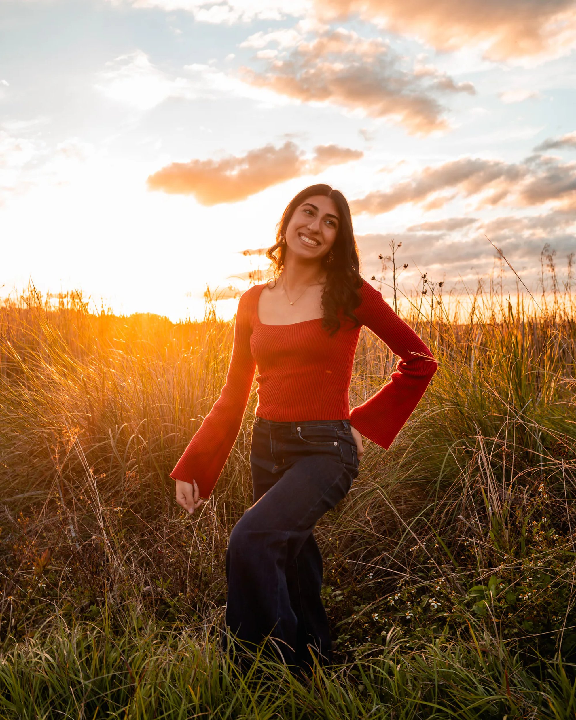 Ahaana posing in warm evening light during senior photos near DeLeon Springs