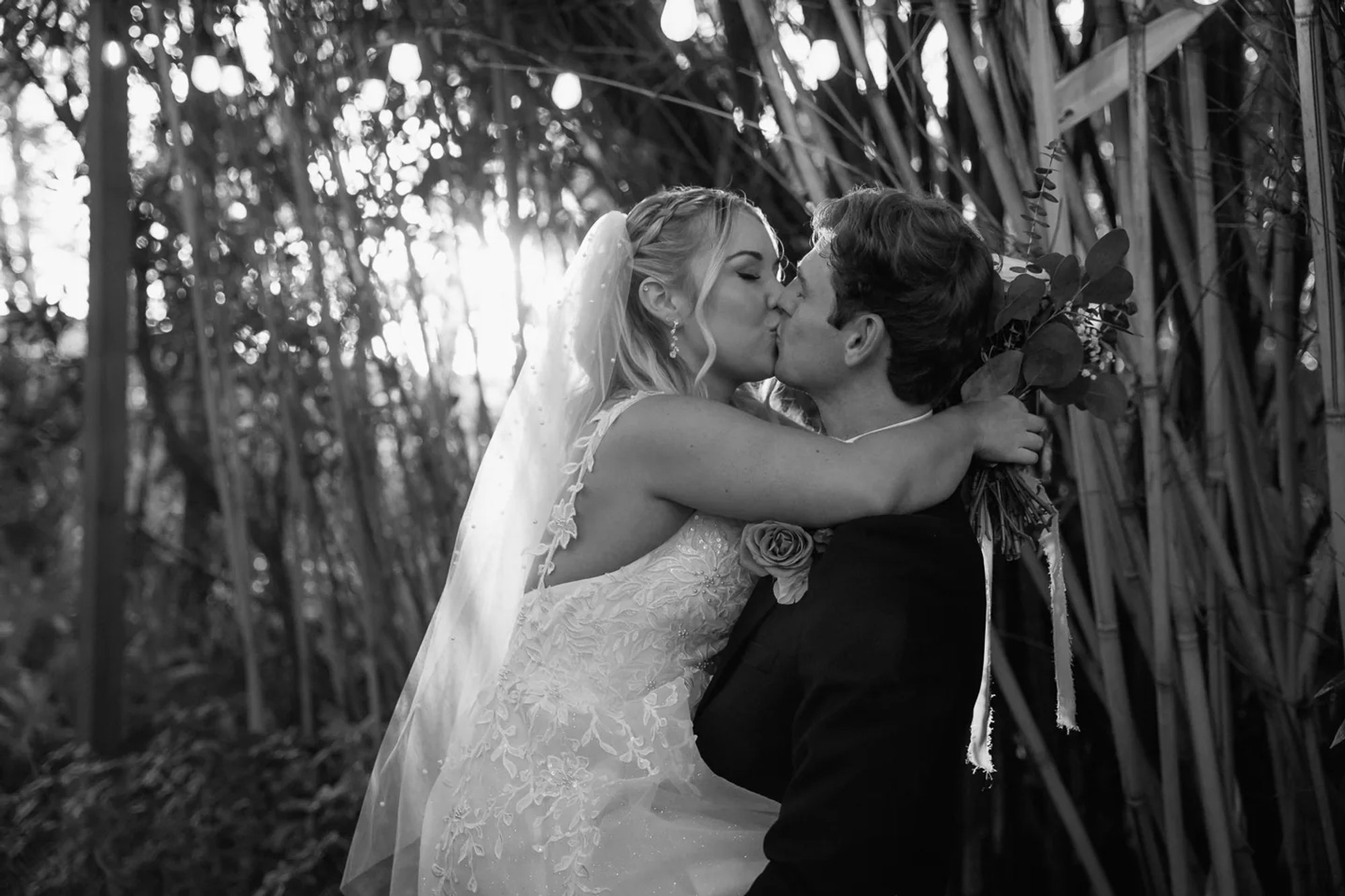 Black and white bride and groom kissing portrait at Bridle Oaks Barn wedding in DeLand Florida