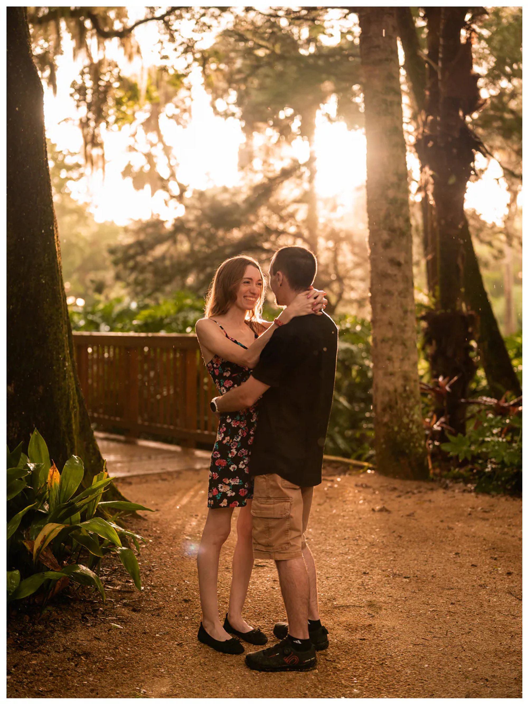 Full-length portrait of a couple embracing on a garden path at Washington Oaks State Park.