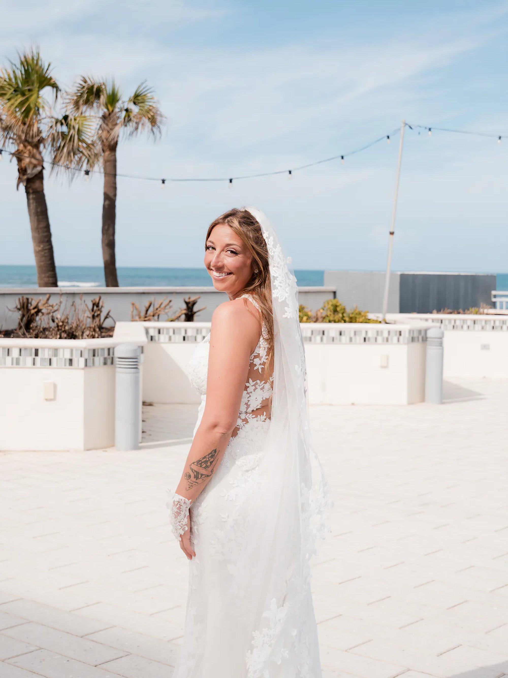 Bride portrait on the outdoor terrace at Hard Rock Hotel in Daytona Beach, FL.