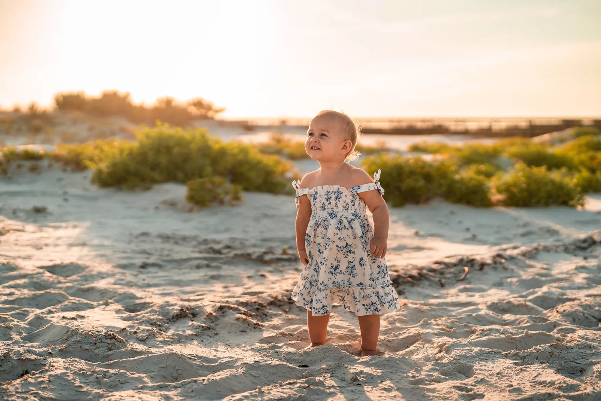 Child walking on the beach during family photos at Ponce Inlet Florida