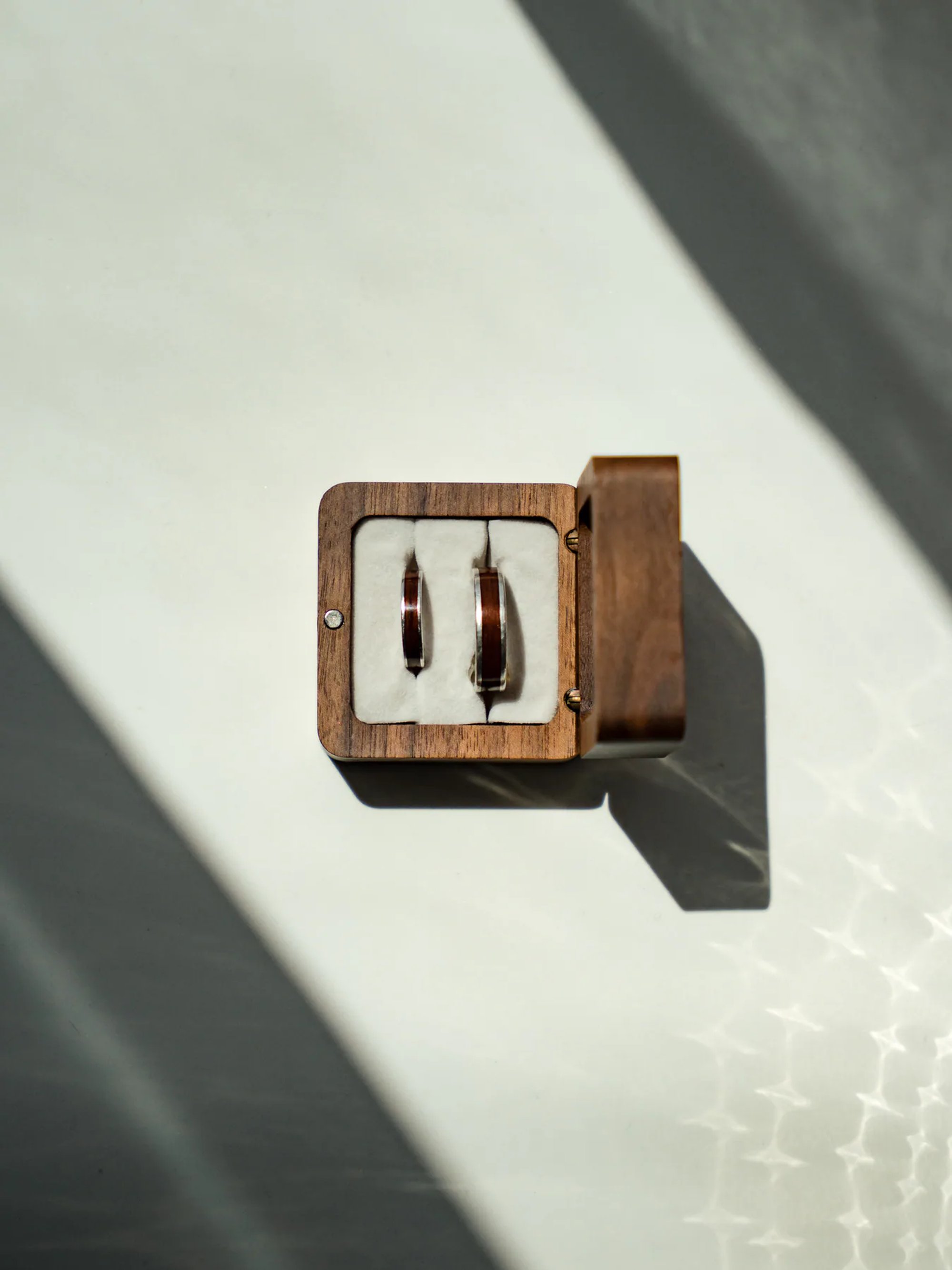 Wedding ring in a wooden ring box at Hard Rock Hotel in Daytona Beach, FL.