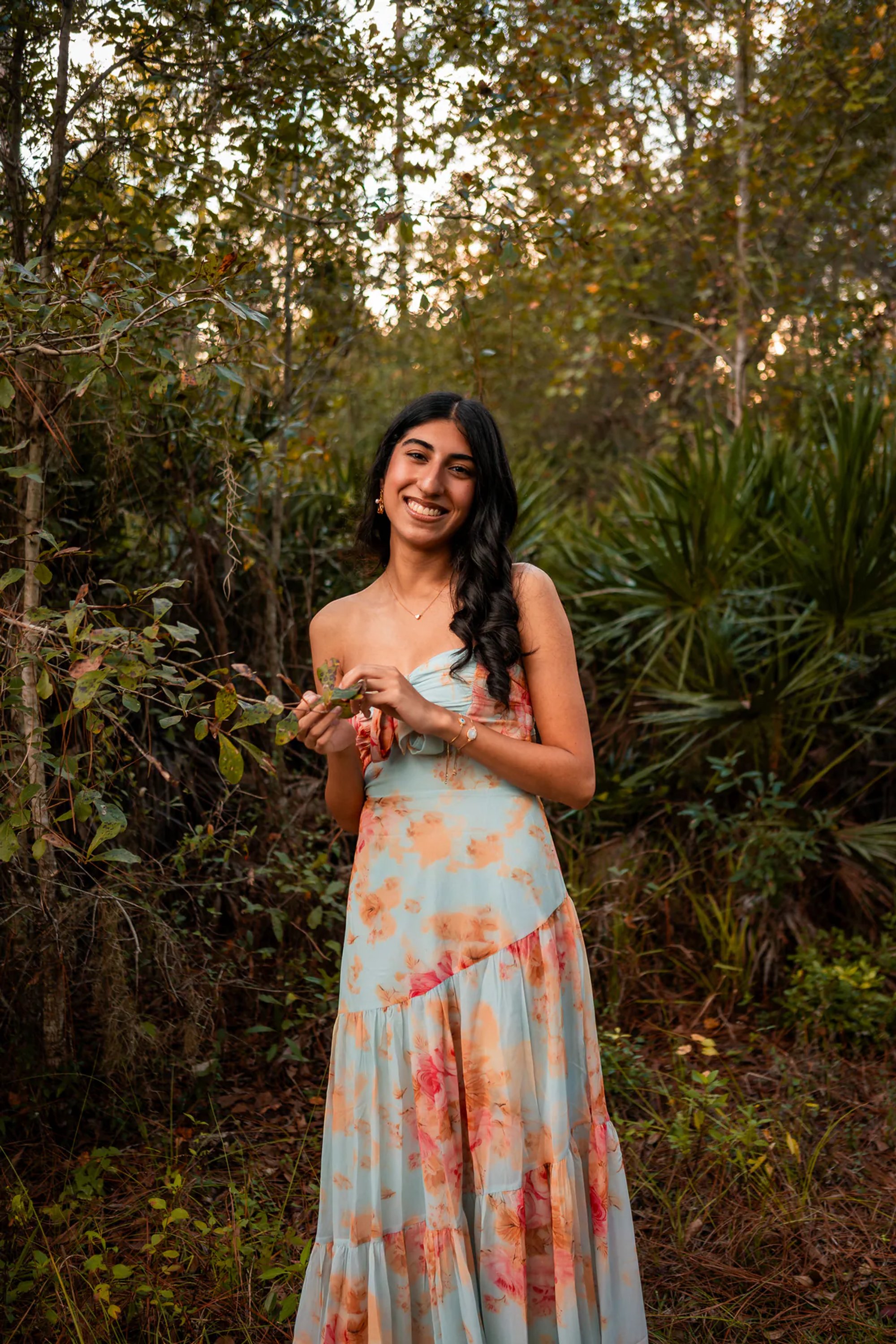 Ahaana in a floral dress surrounded by Florida greenery at Lake Woodruff