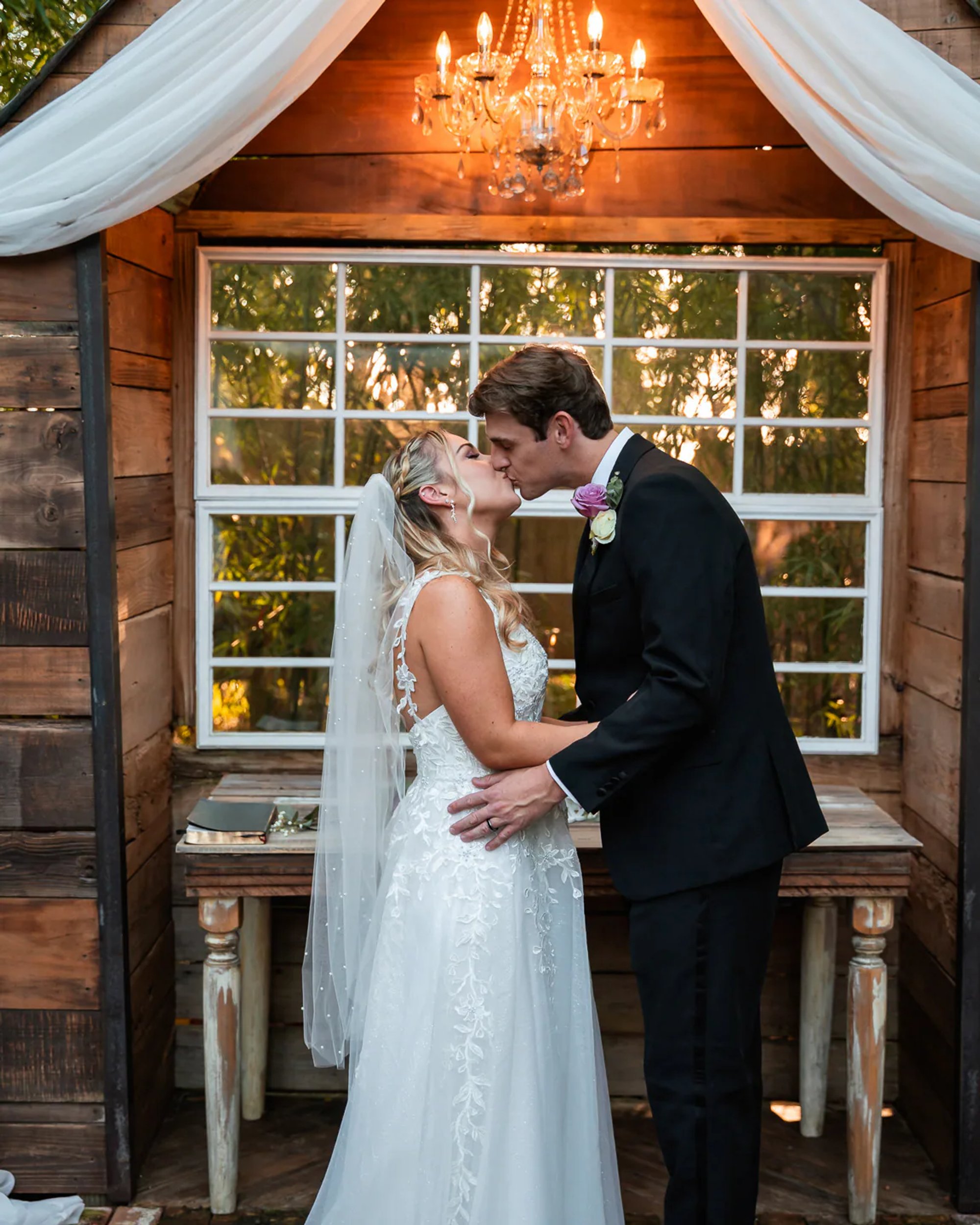 Close bride and groom kiss portrait at Bridle Oaks Barn wedding venue in DeLand Florida