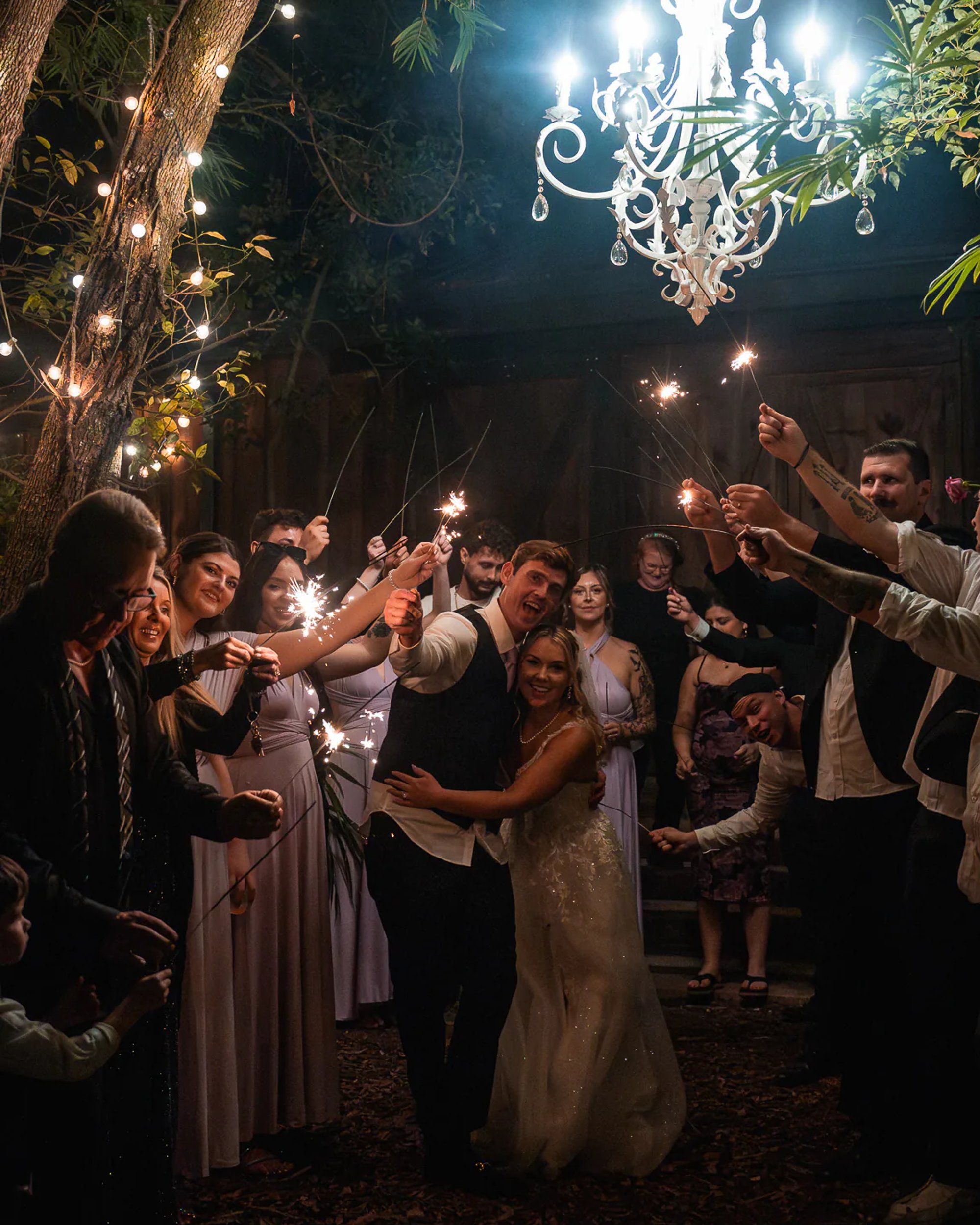 Bride and groom sparkler exit with wedding guests at Bridle Oaks Barn in DeLand Florida