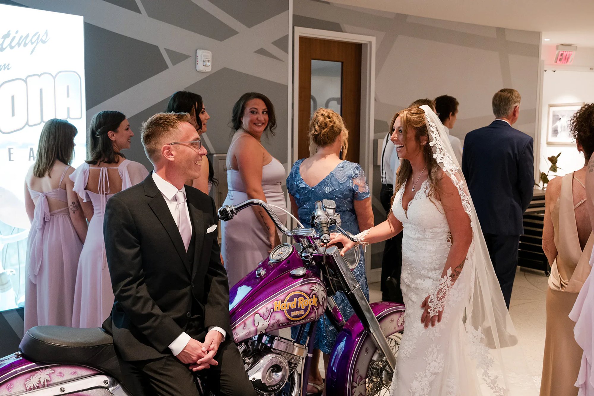 Bride walking into the first look at Hard Rock Hotel Daytona Beach with guests watching.
