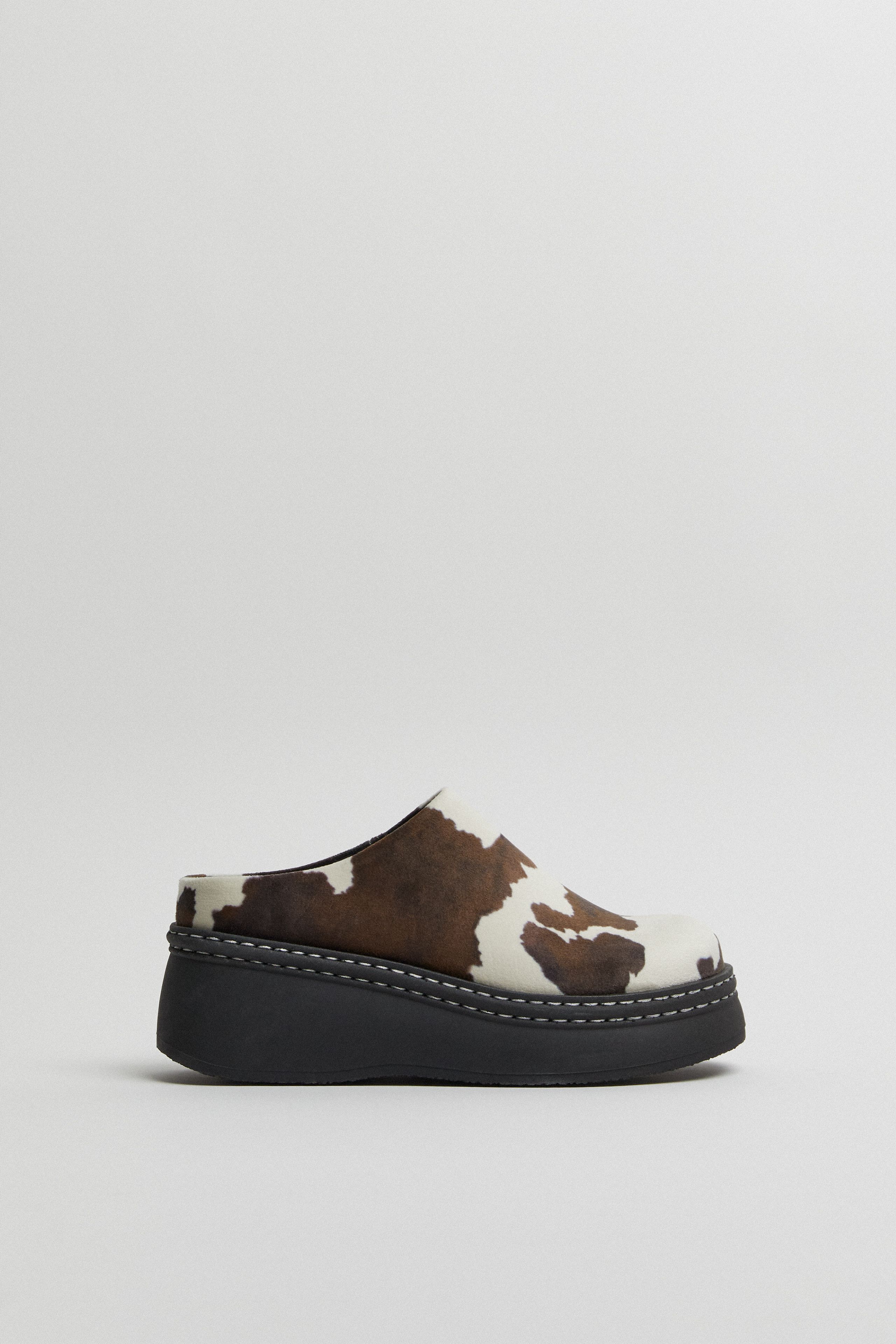 Kristi Mules - Cow Print Faux Suede | Miista