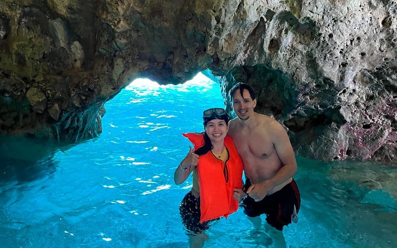 happy clients doing snorkeling under caves