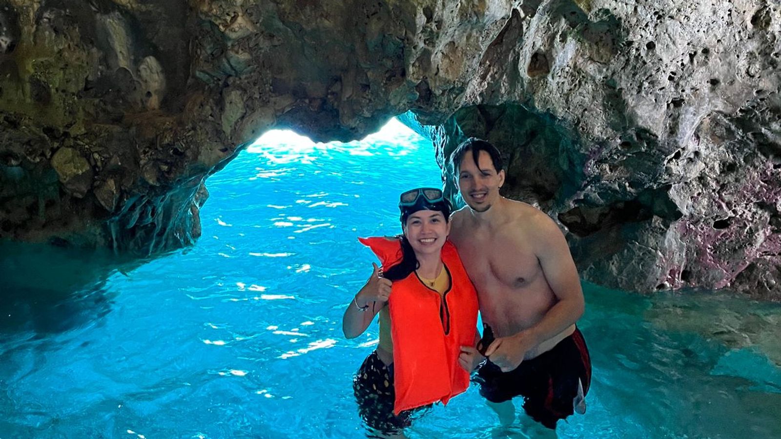 happy clients doing snorkeling under caves