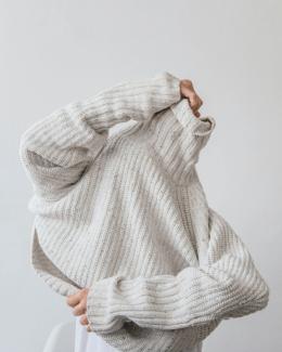 A white turtle neck sweater