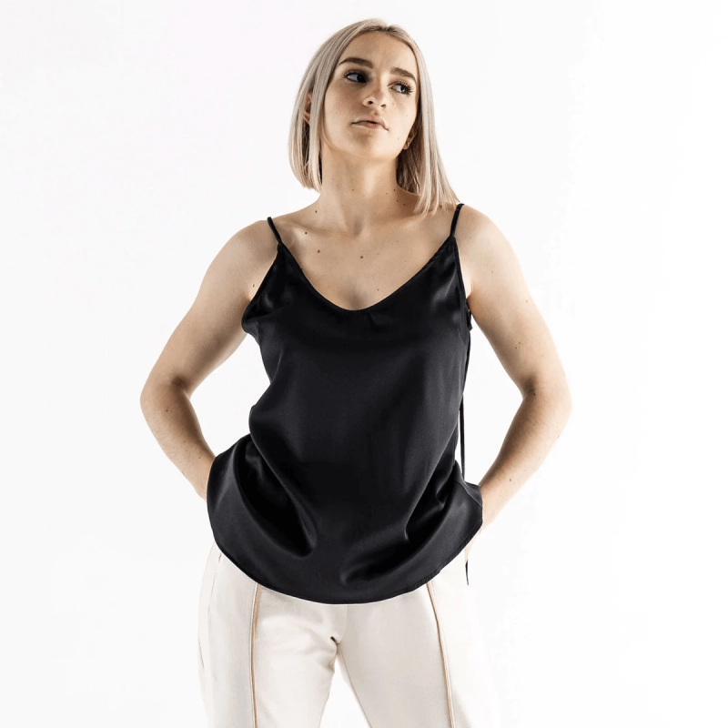 A girl wearing Milano Women's black silk top.