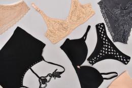 Top view of neutral colored lingerie products including bras, panties, and a crop top.