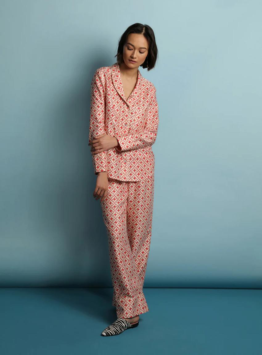 girl in orange and red silk pajamas