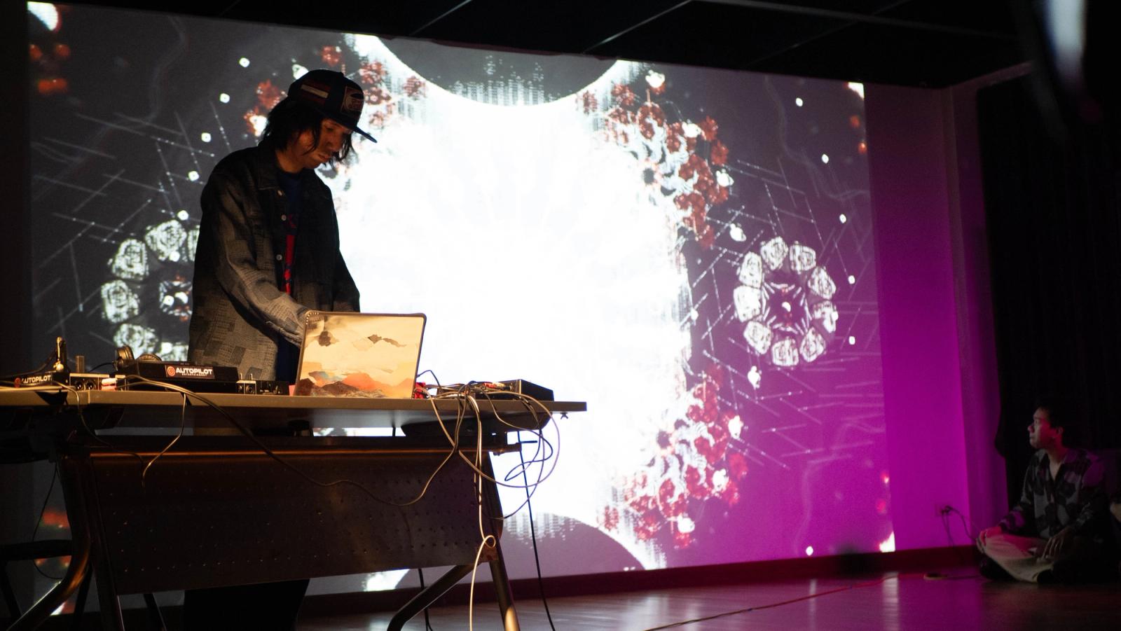 Cool Dub Club performing in front of the visuals
