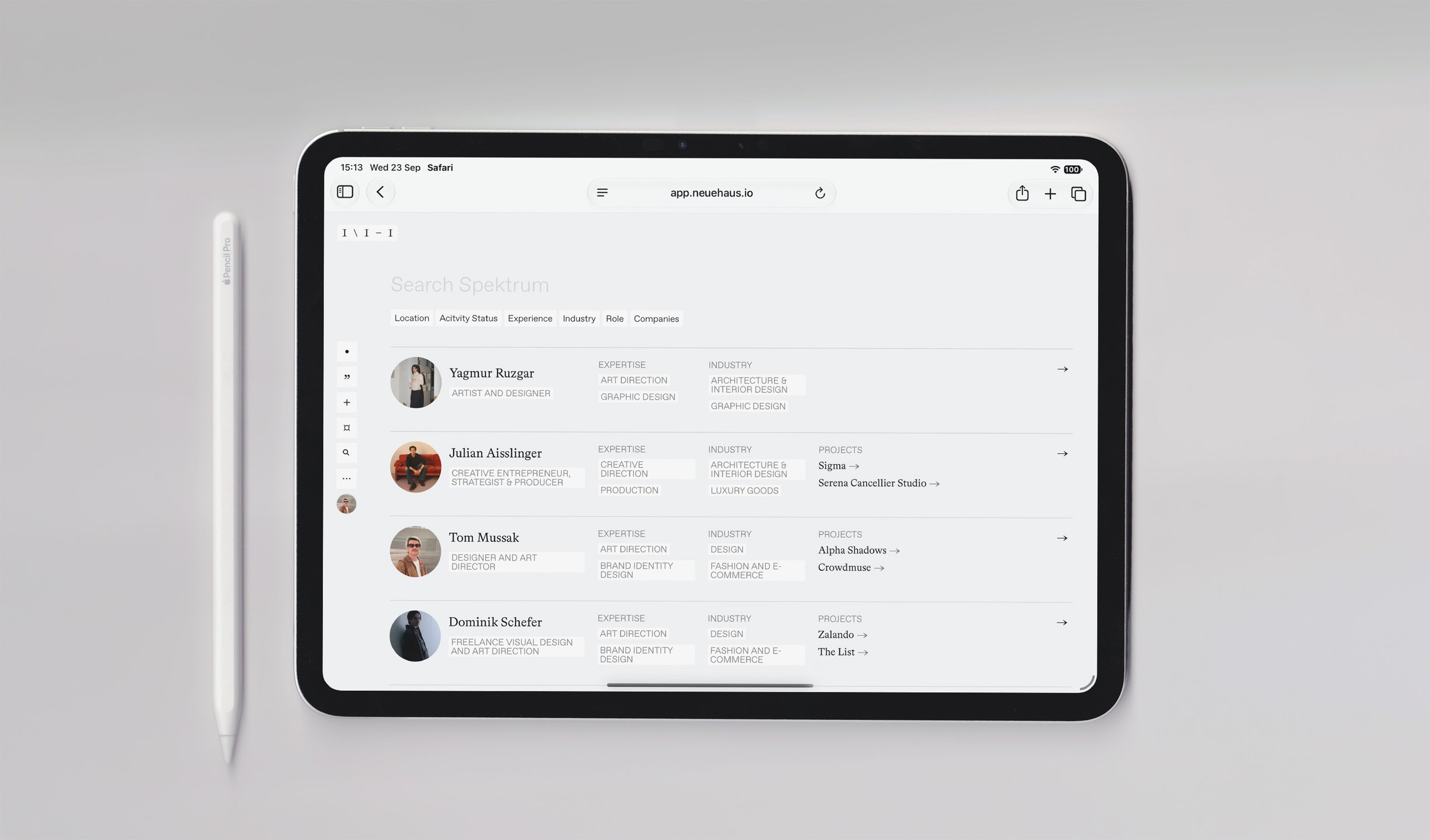A tablet showing a share sheet of members, with a pencil beside it.