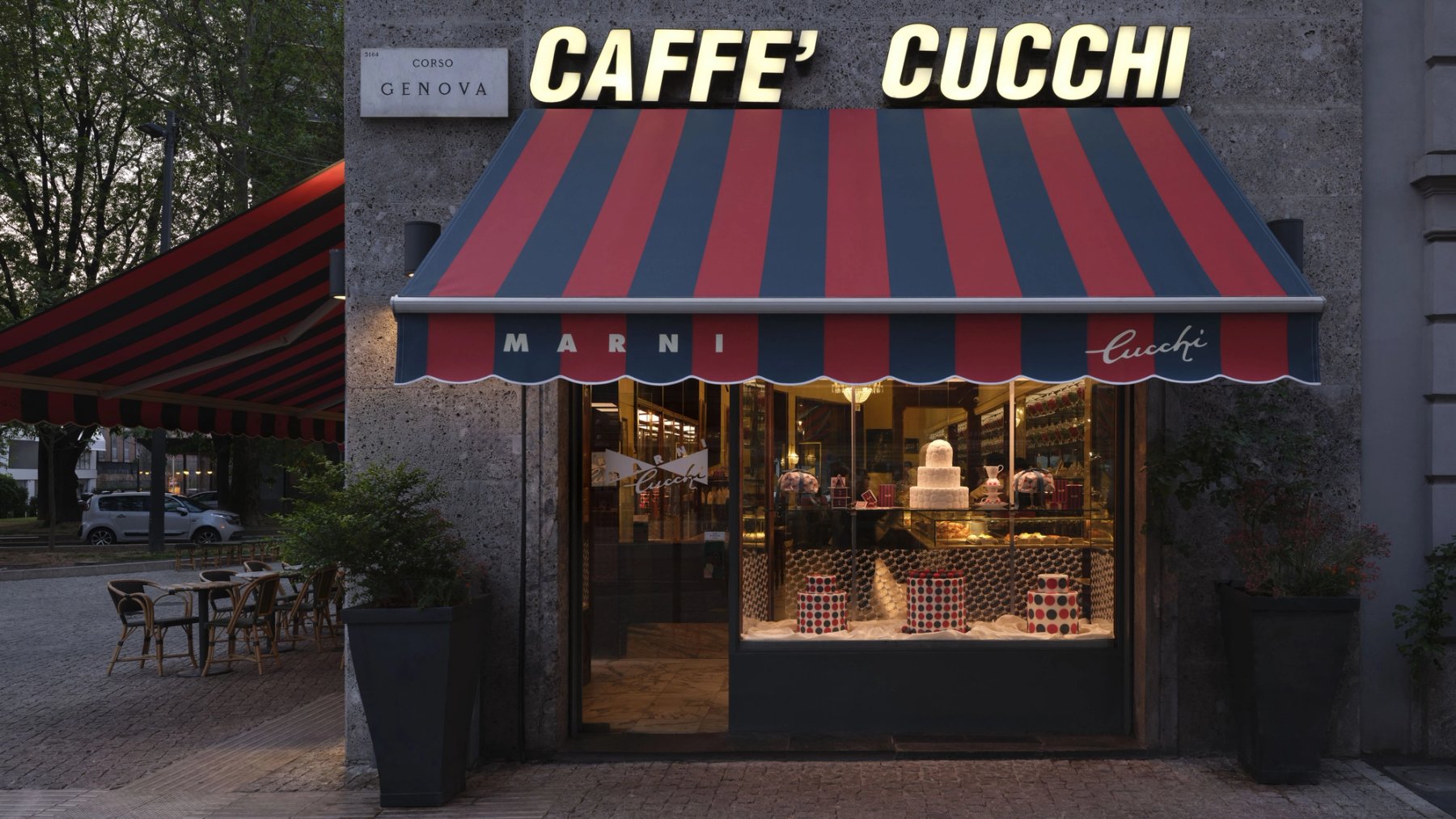The front of Caffe Cucchi in Milan, under its red and blue striped awning.