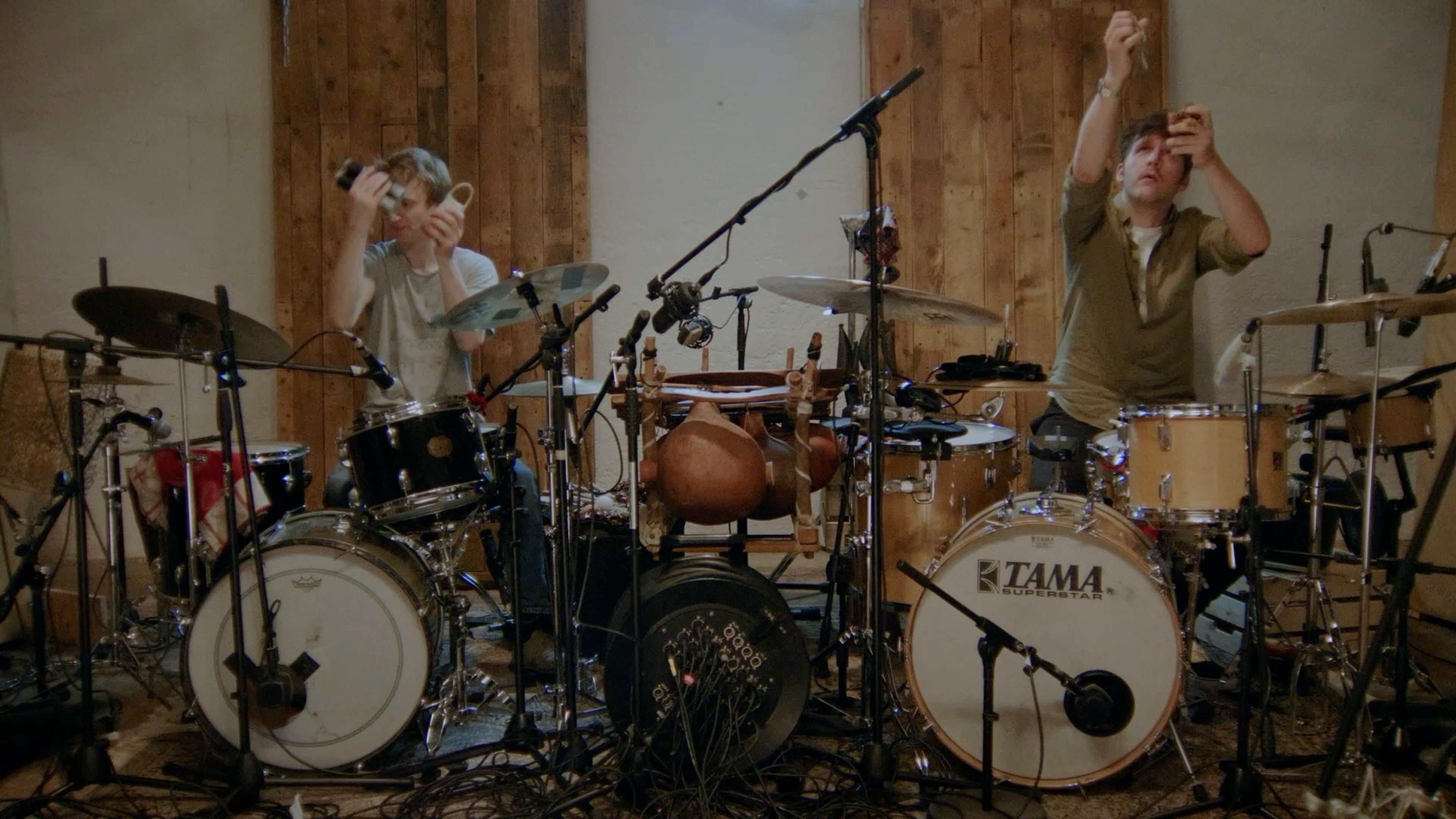 Sebastian Wolfgruber and Simon Popp playing drums in the studio