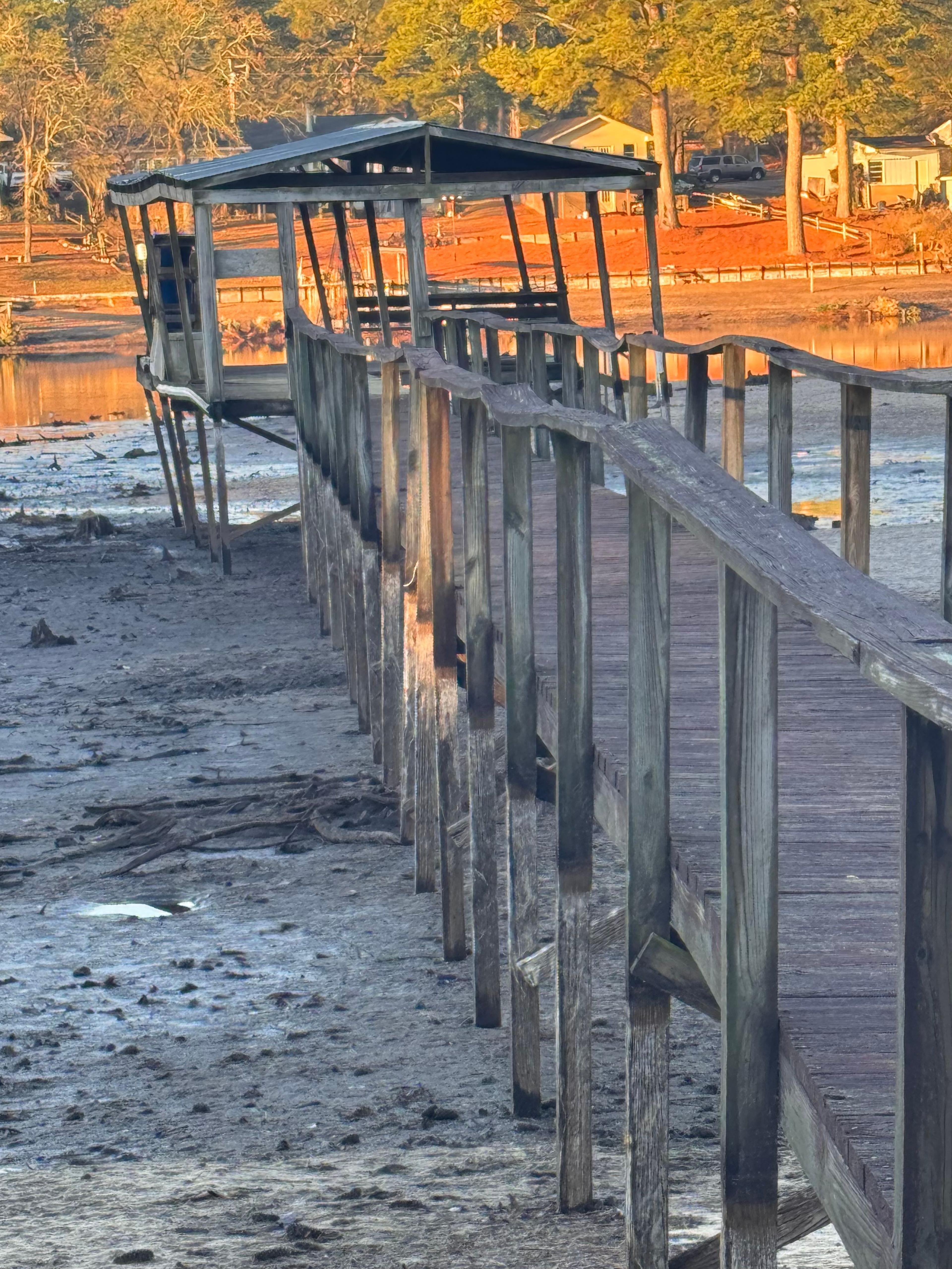 weathered boat dock about to fall over